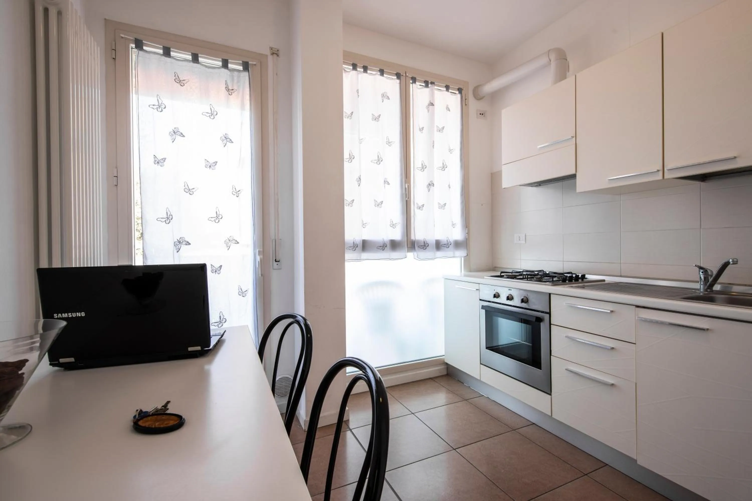 Kitchen or kitchenette in Amadei Hotel Figaro & Apartments