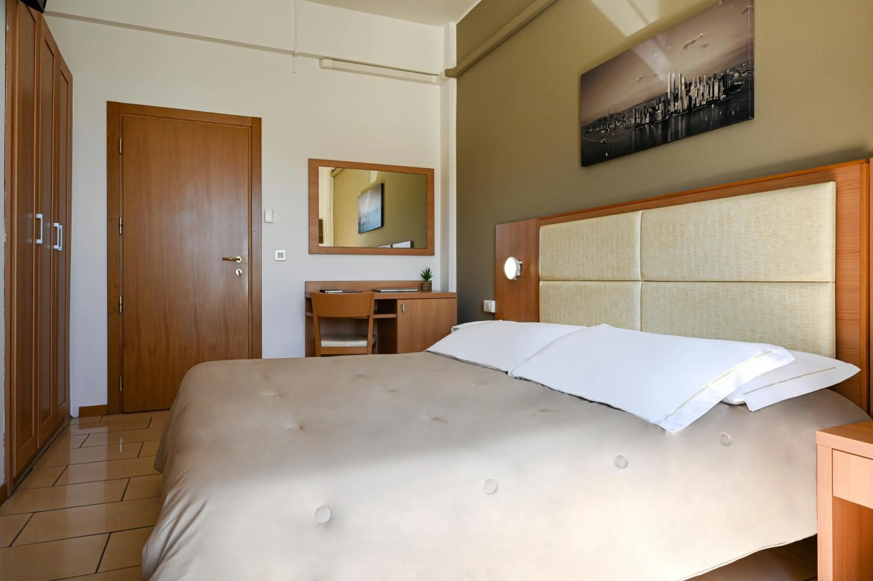 Bed in Amadei Hotel Figaro & Apartments