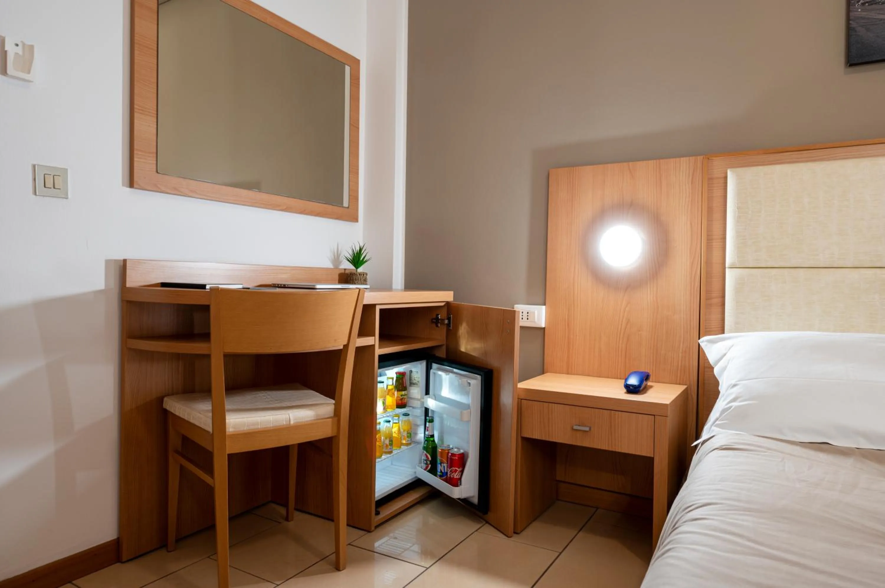 Bed in Amadei Hotel Figaro & Apartments