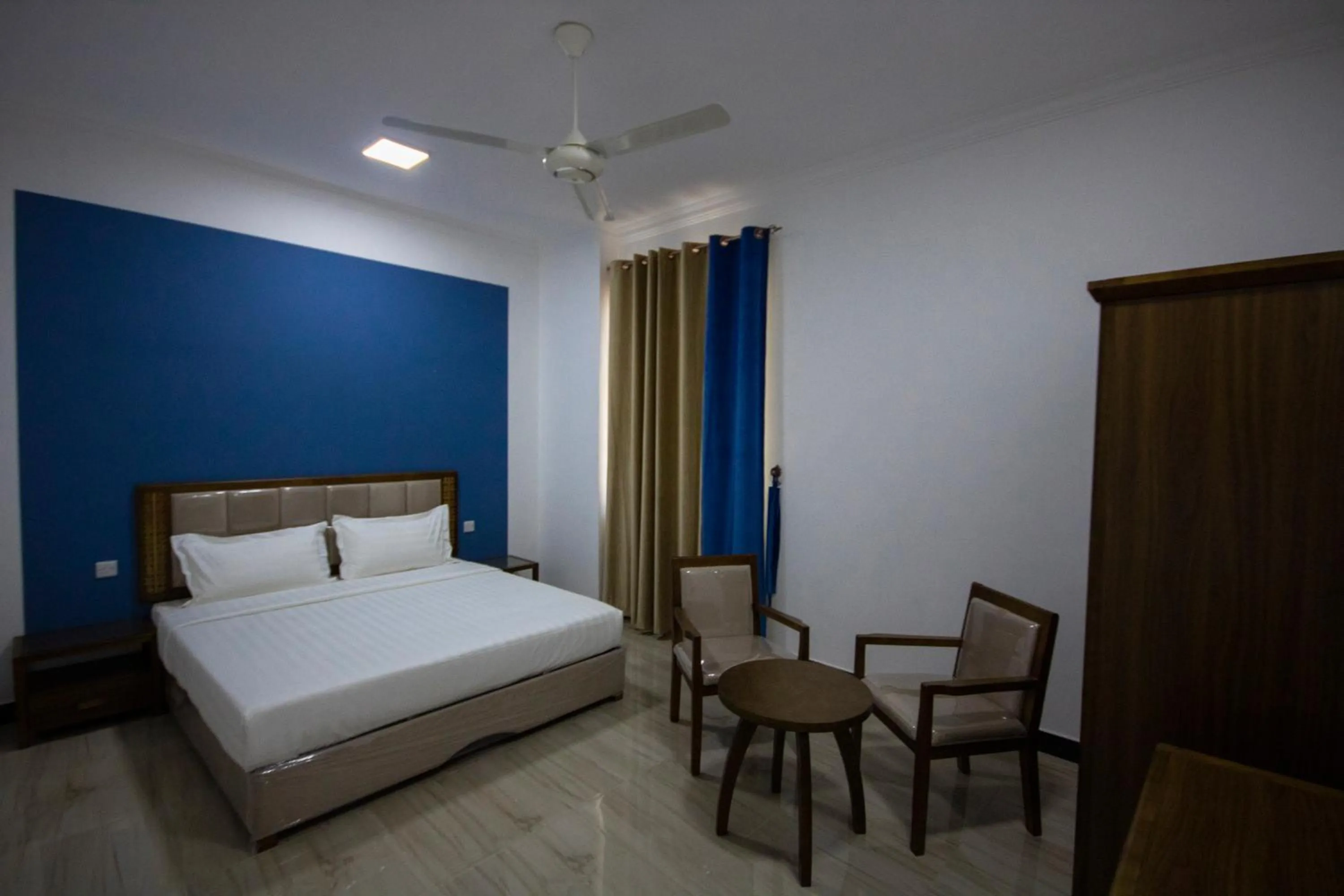 Bed in Home Station Hotel