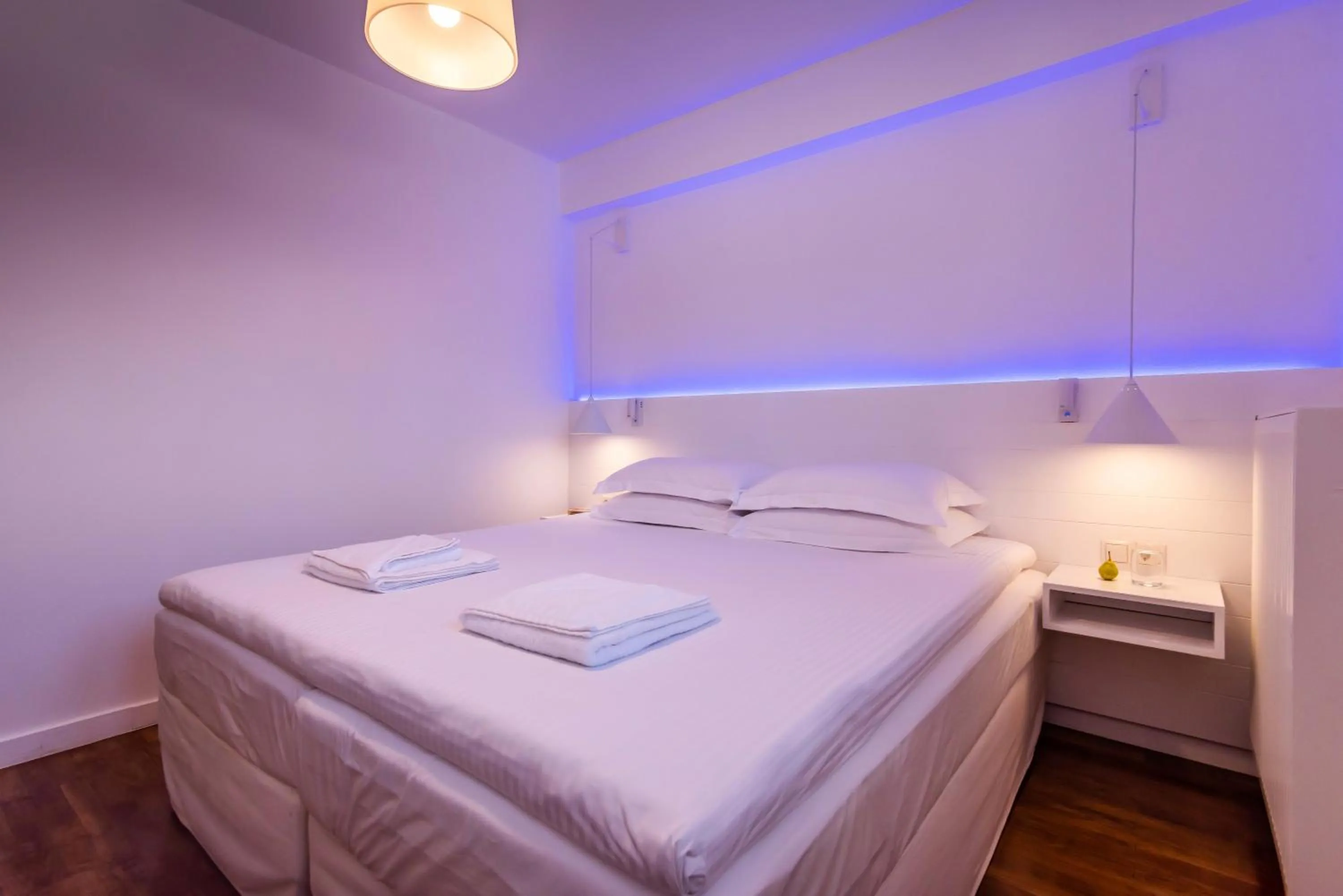 Bed in White Rock Milos Suites