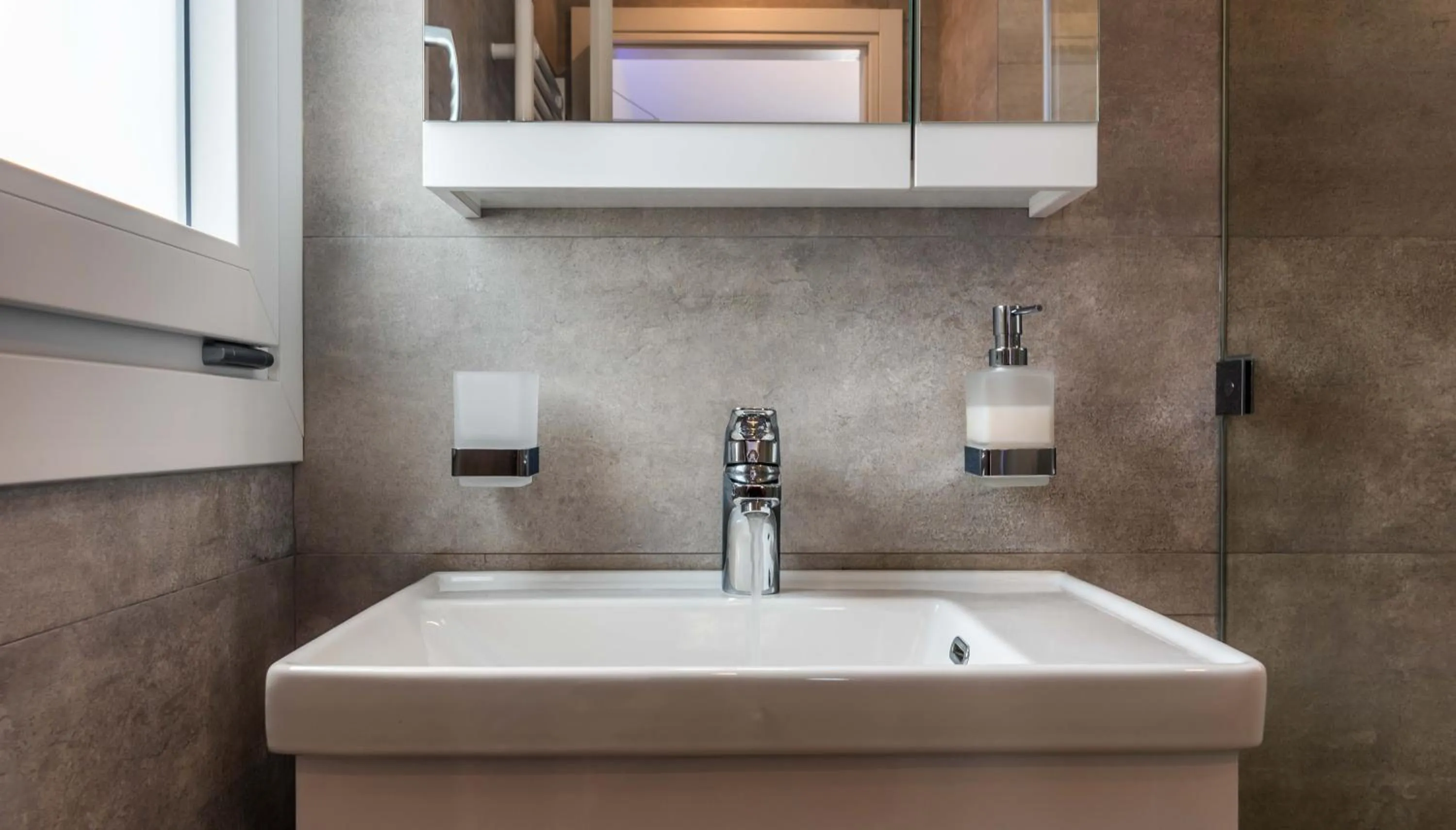 Bathroom in White Rock Milos Suites