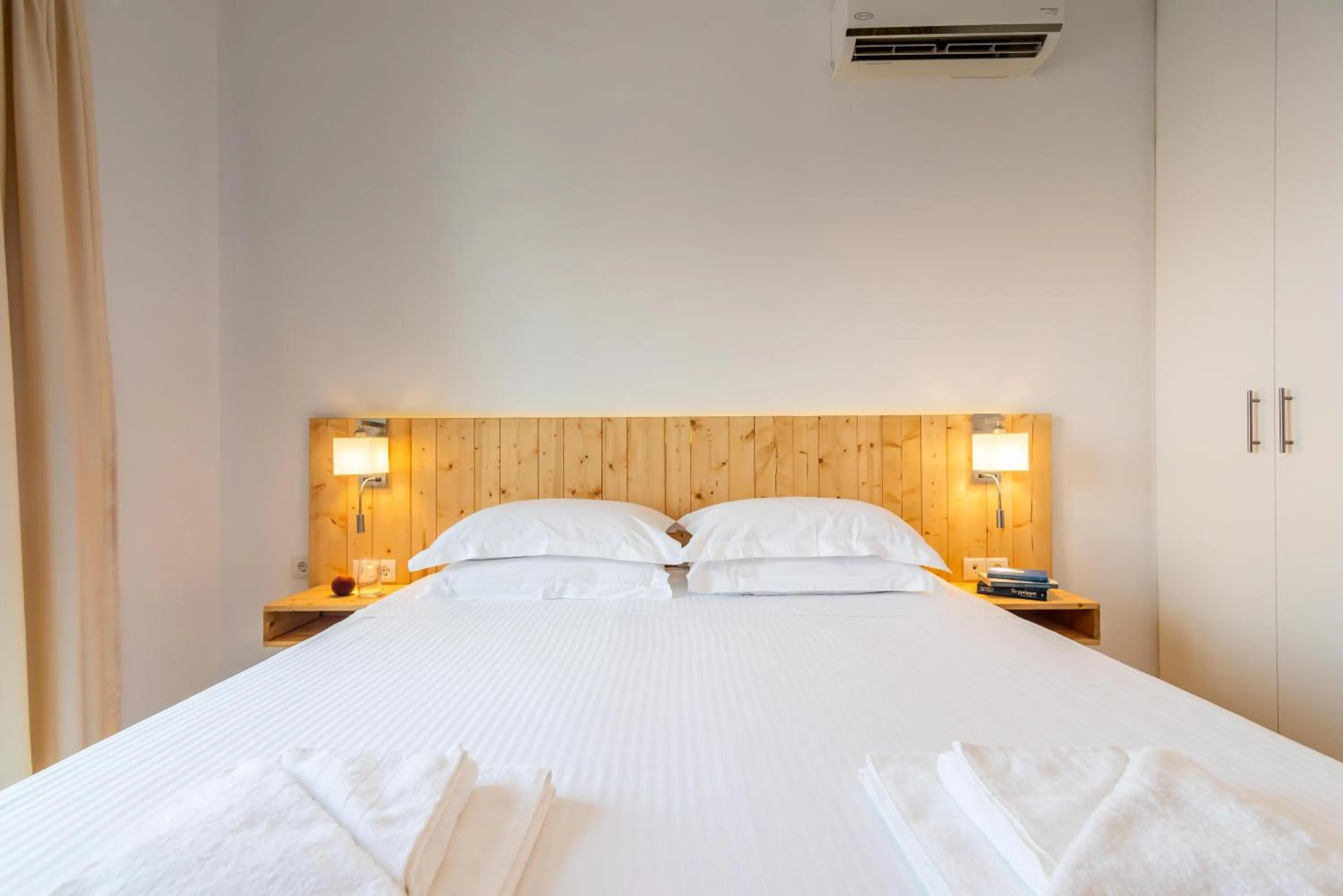 Bed in White Rock Milos Suites