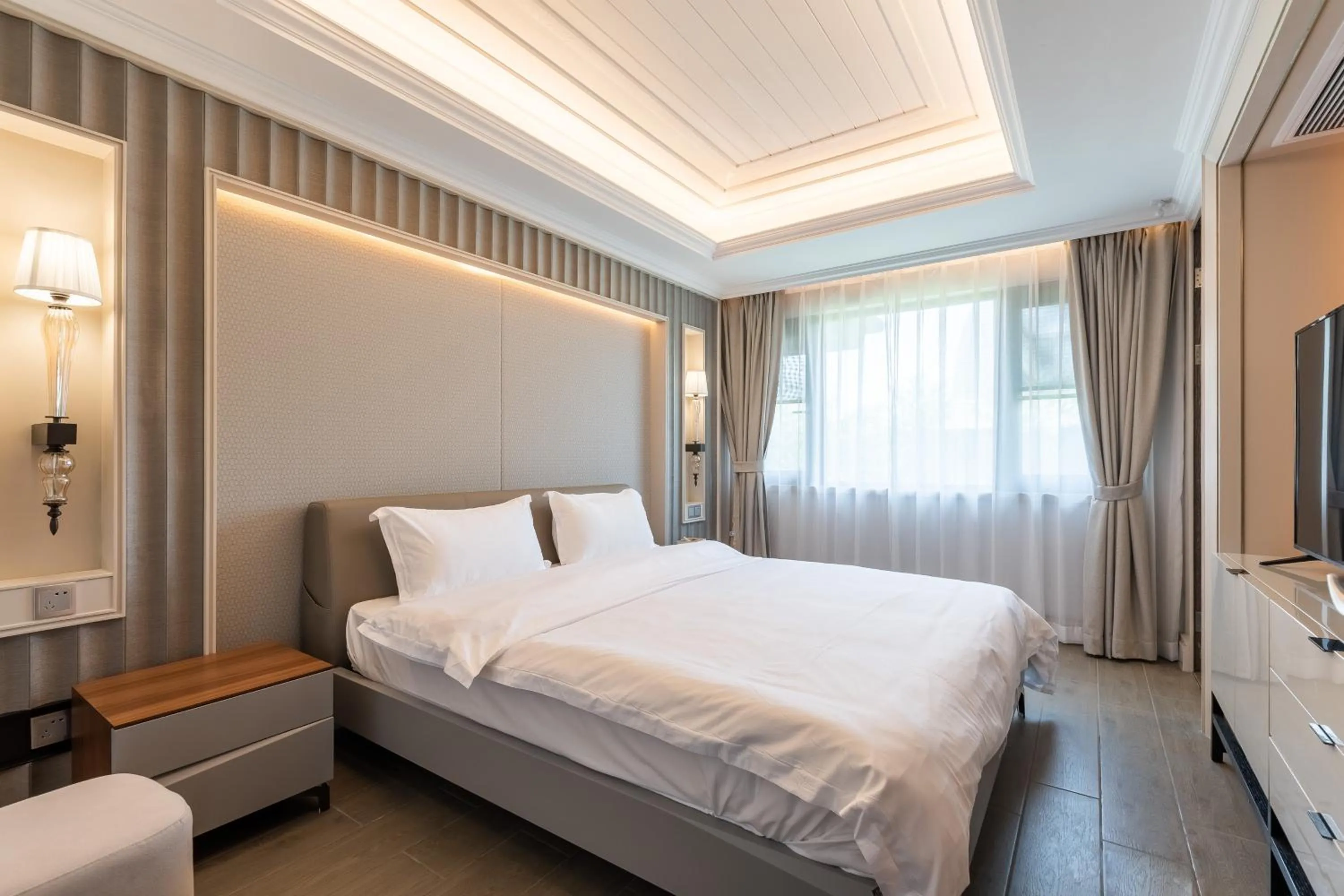 Bed in HaitangBay Loosen Coast Resort Villas