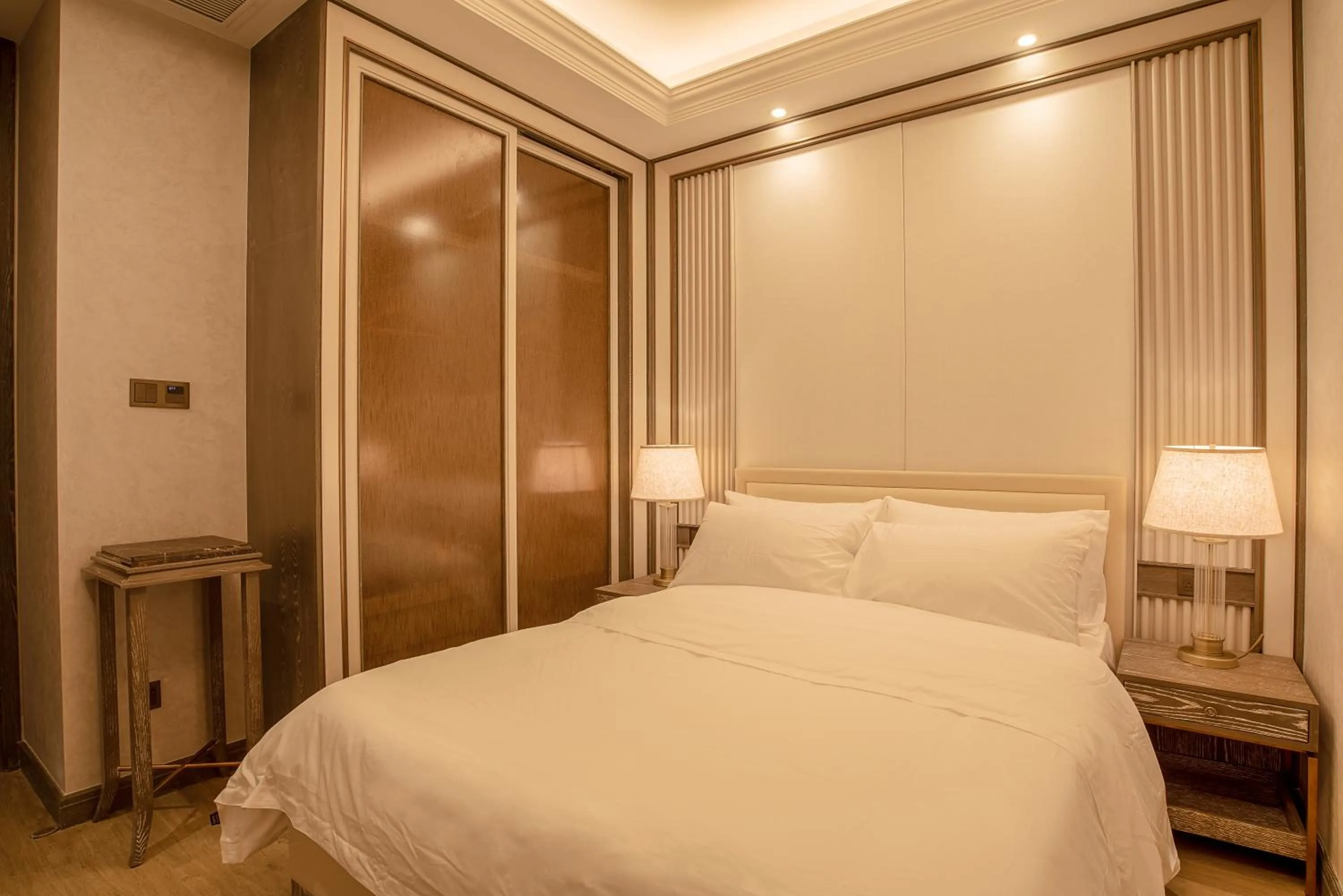 Bed in HaitangBay Loosen Coast Resort Villas