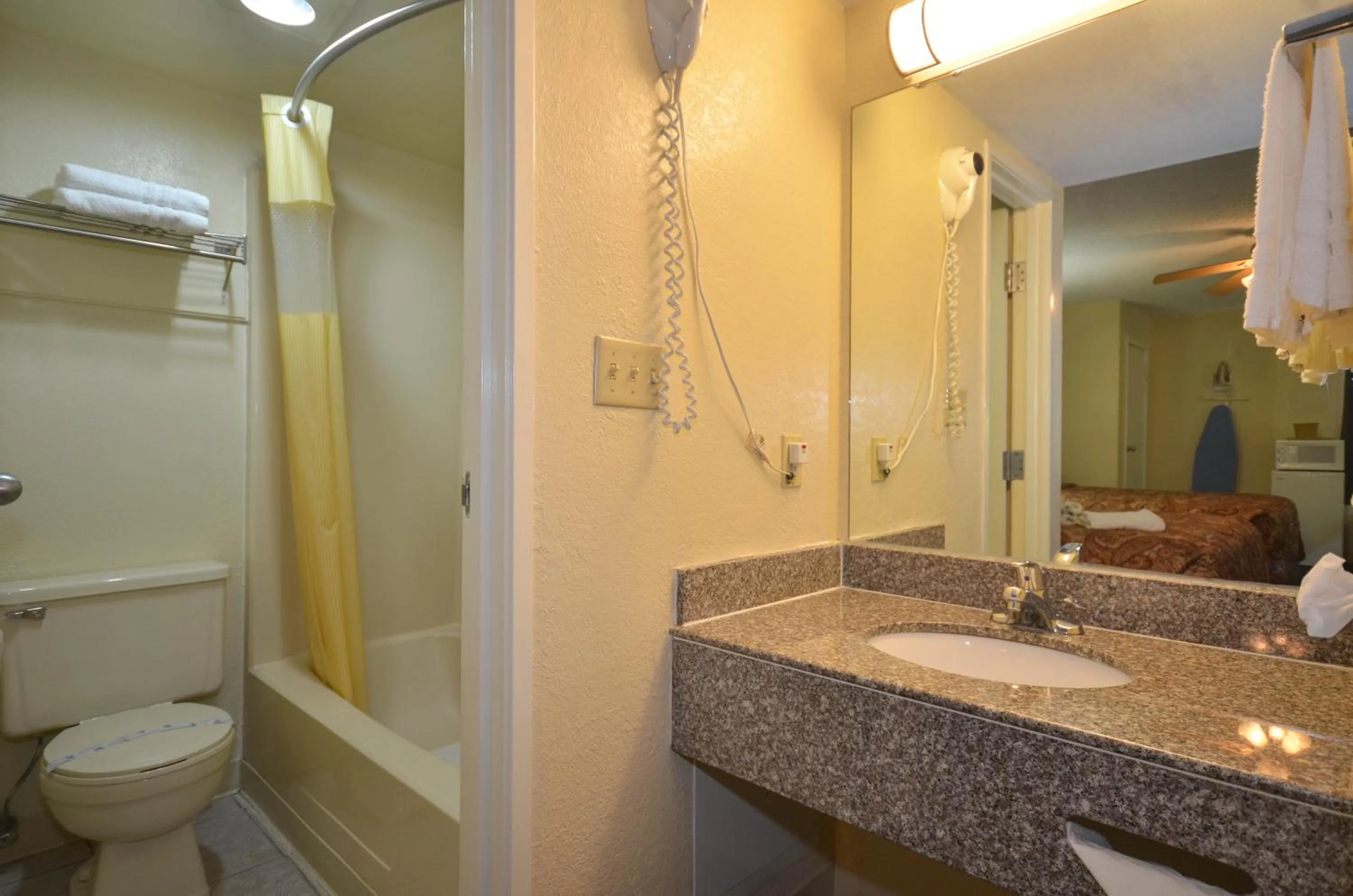 Bathroom in Days Inn by Wyndham Southern Hills/ORU