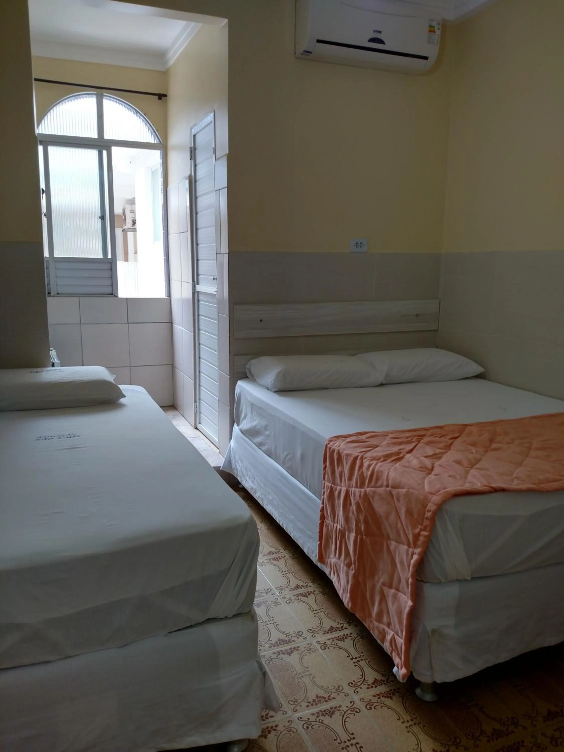 Bed in Pousada São Luiz