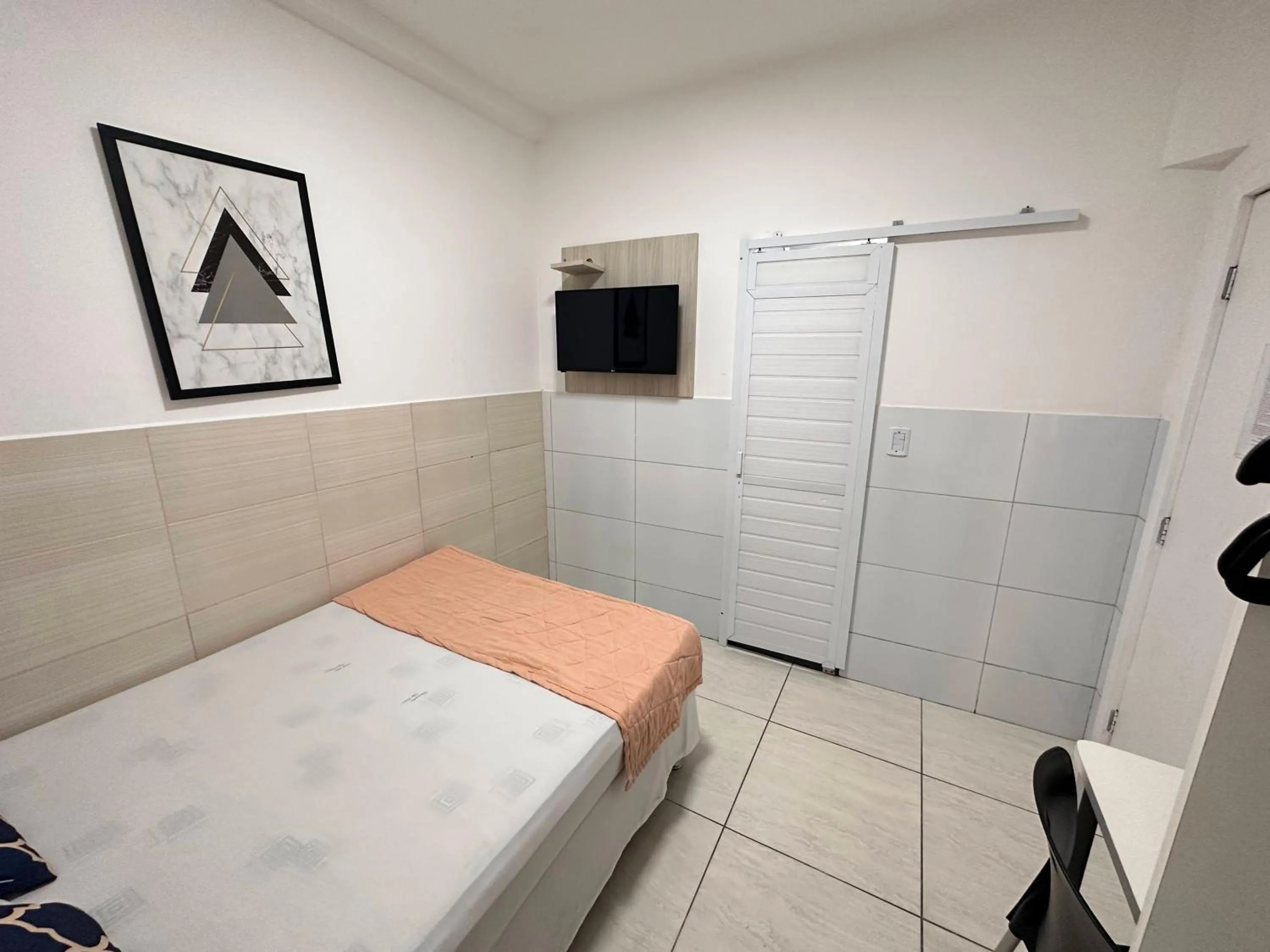 Bed in Pousada São Luiz