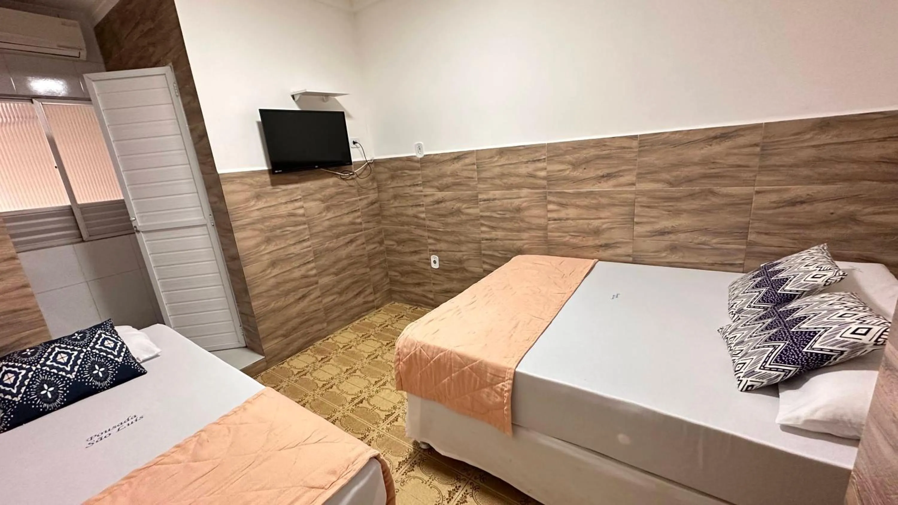 Bed in Pousada São Luiz