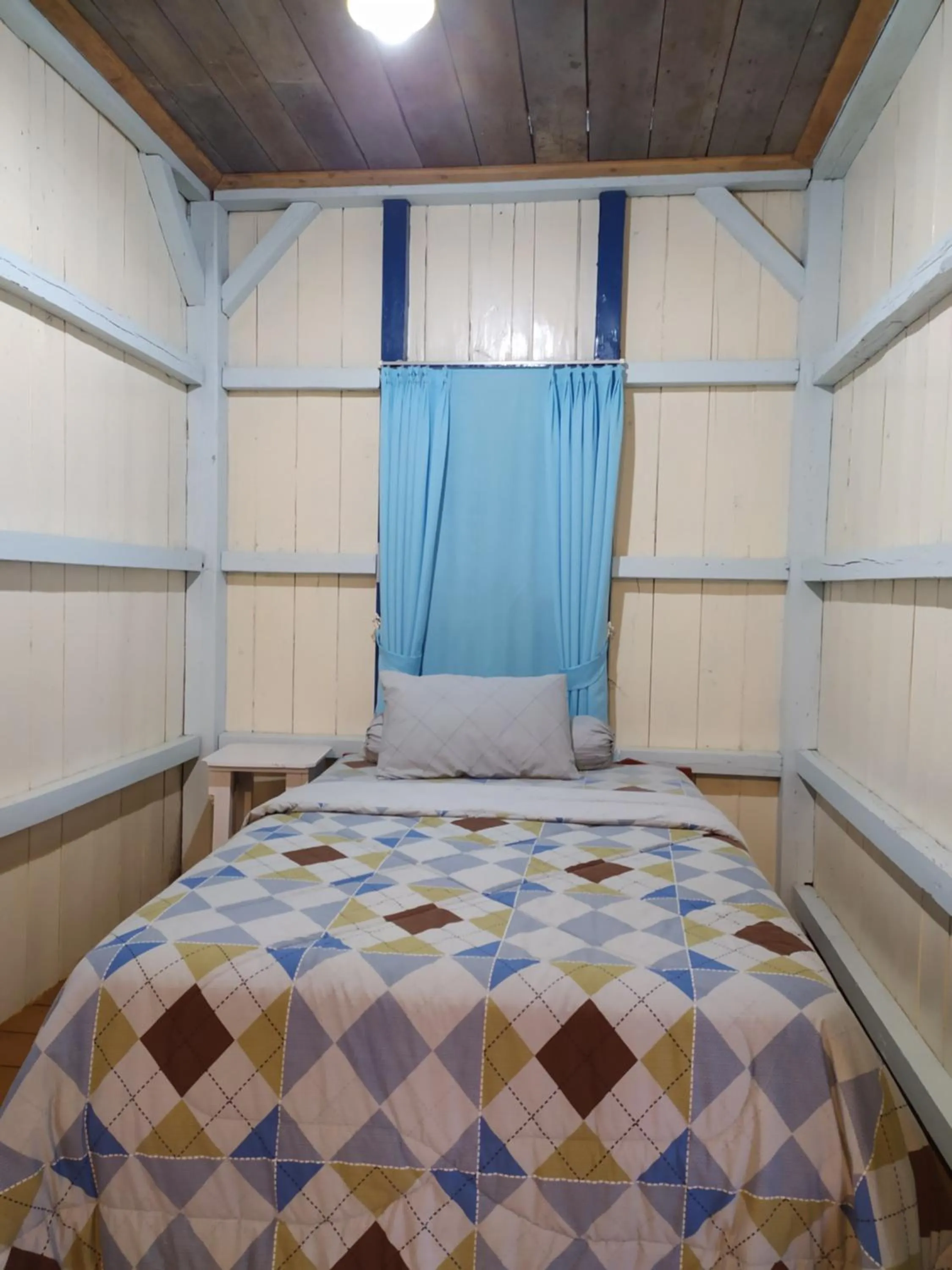 Bed in Rock and Wreck Dive Resort