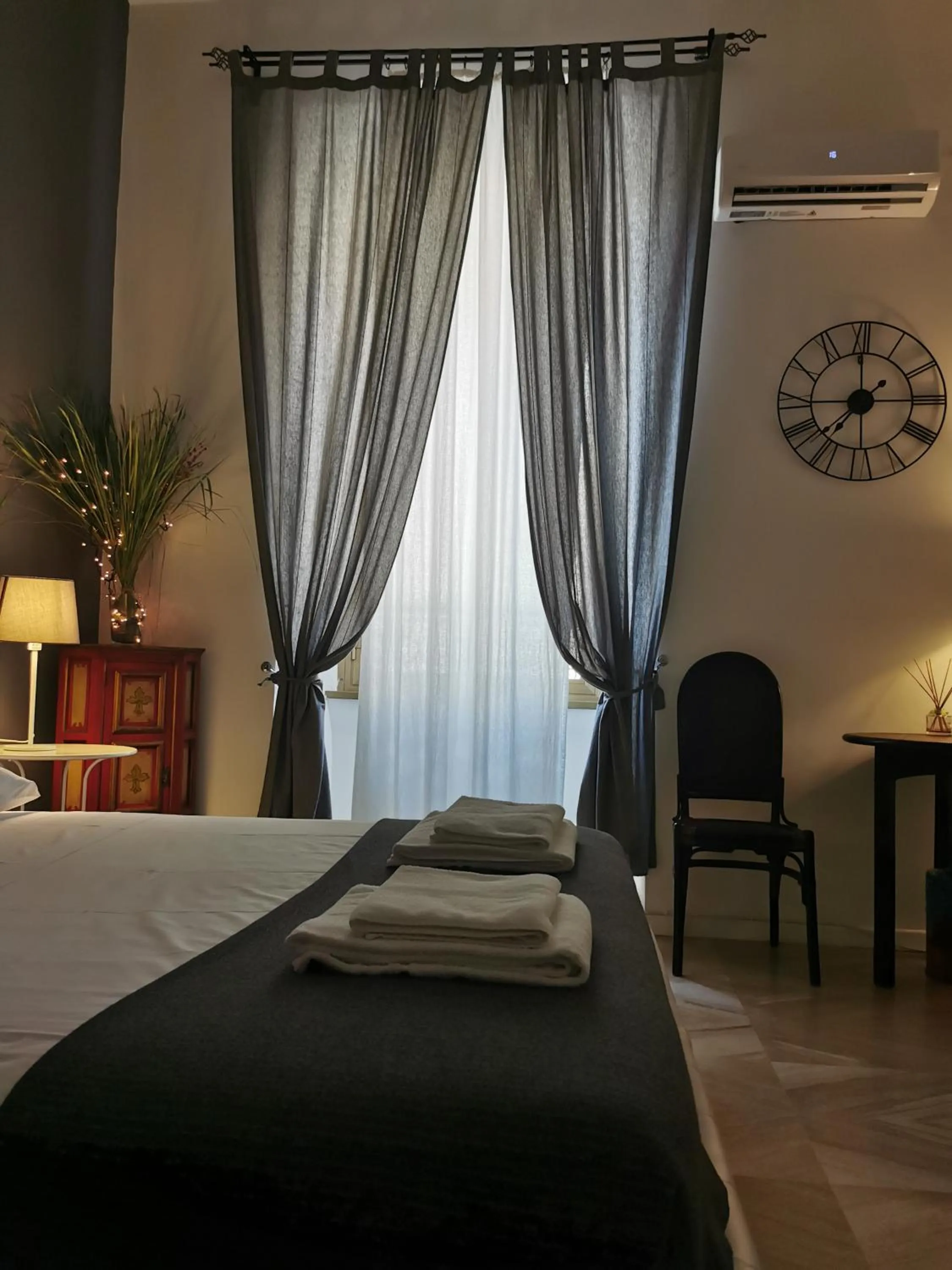 Bed in 109 SUITES ROMA