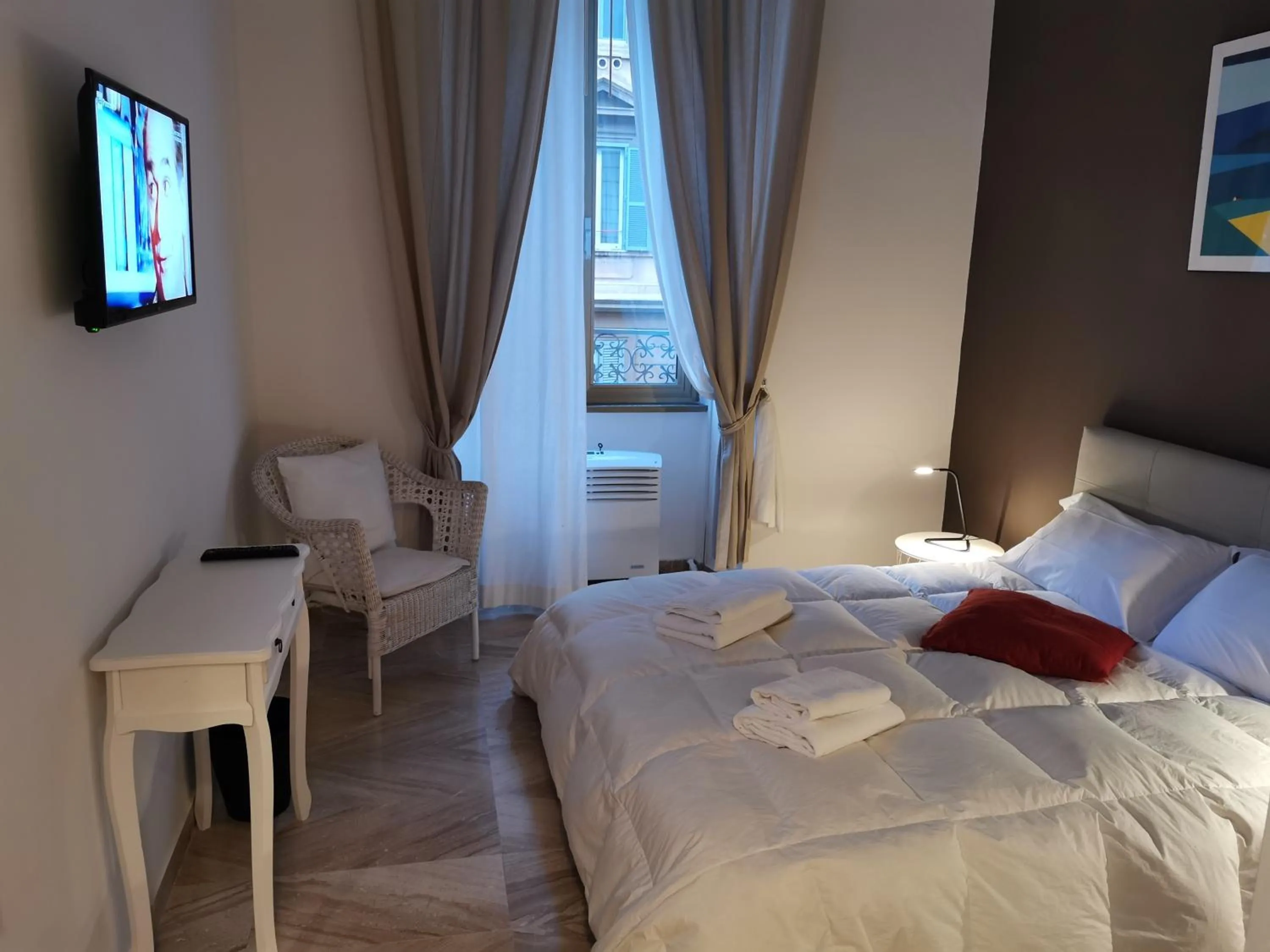 Bed in 109 SUITES ROMA