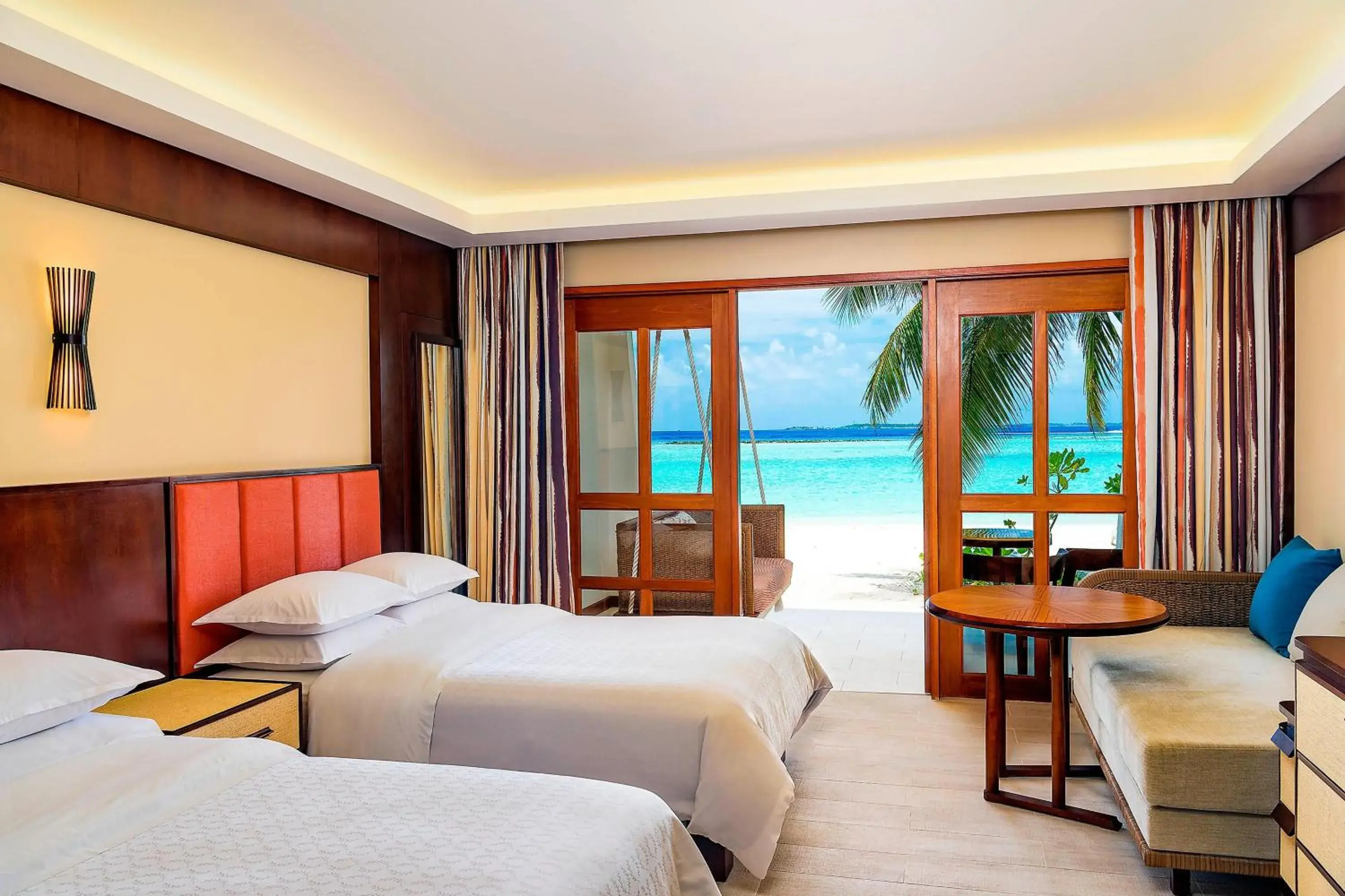 Deluxe Double Room with Two Double Beds and Beach View in Sheraton Maldives Full Moon Resort & Spa Deluxe Double Room with Two Double Beds and Beach View in Sheraton Maldives Full Moon Resort & Spa