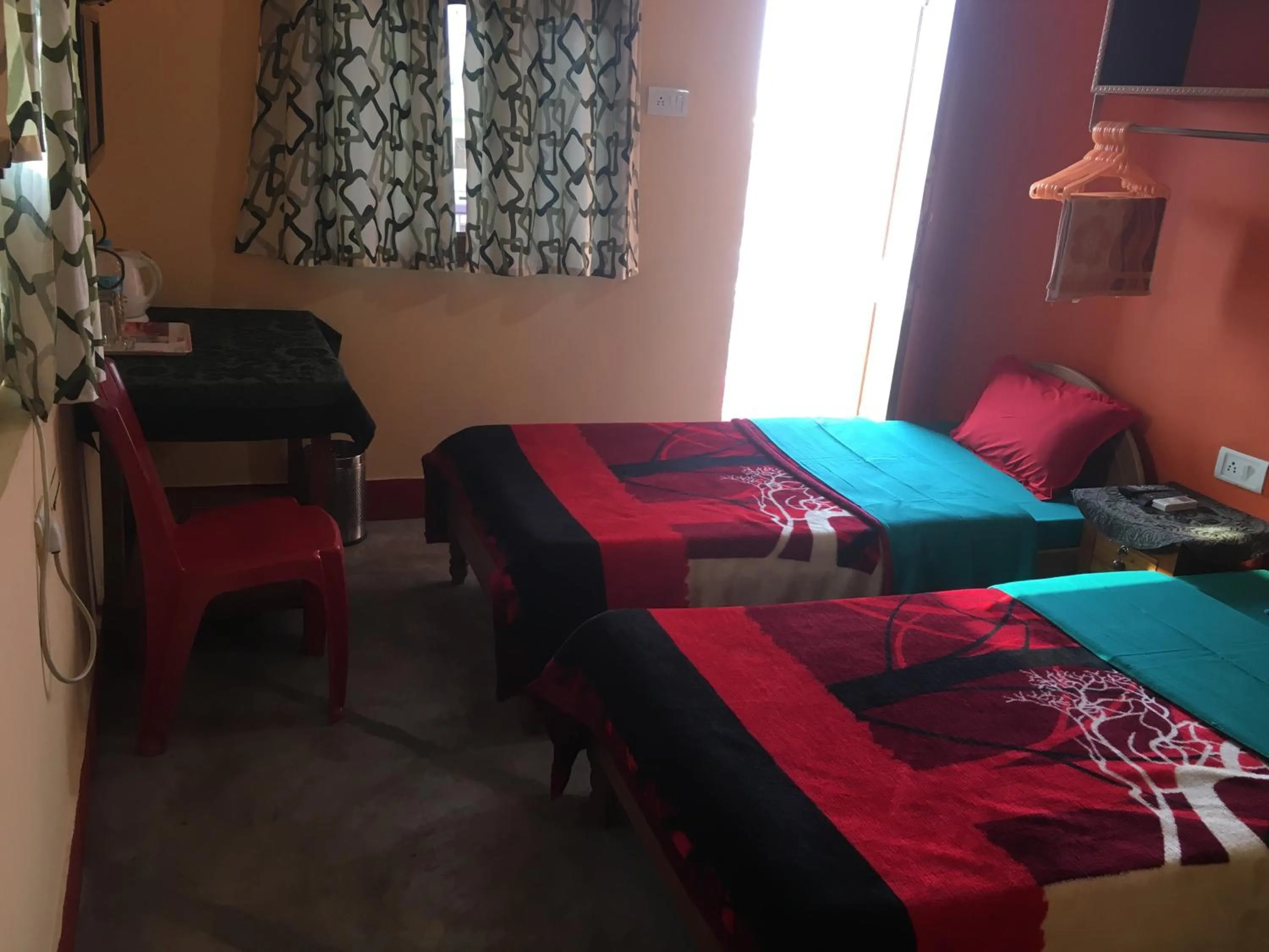 Photo of the whole room, Bed in Kundanbazar Guest House