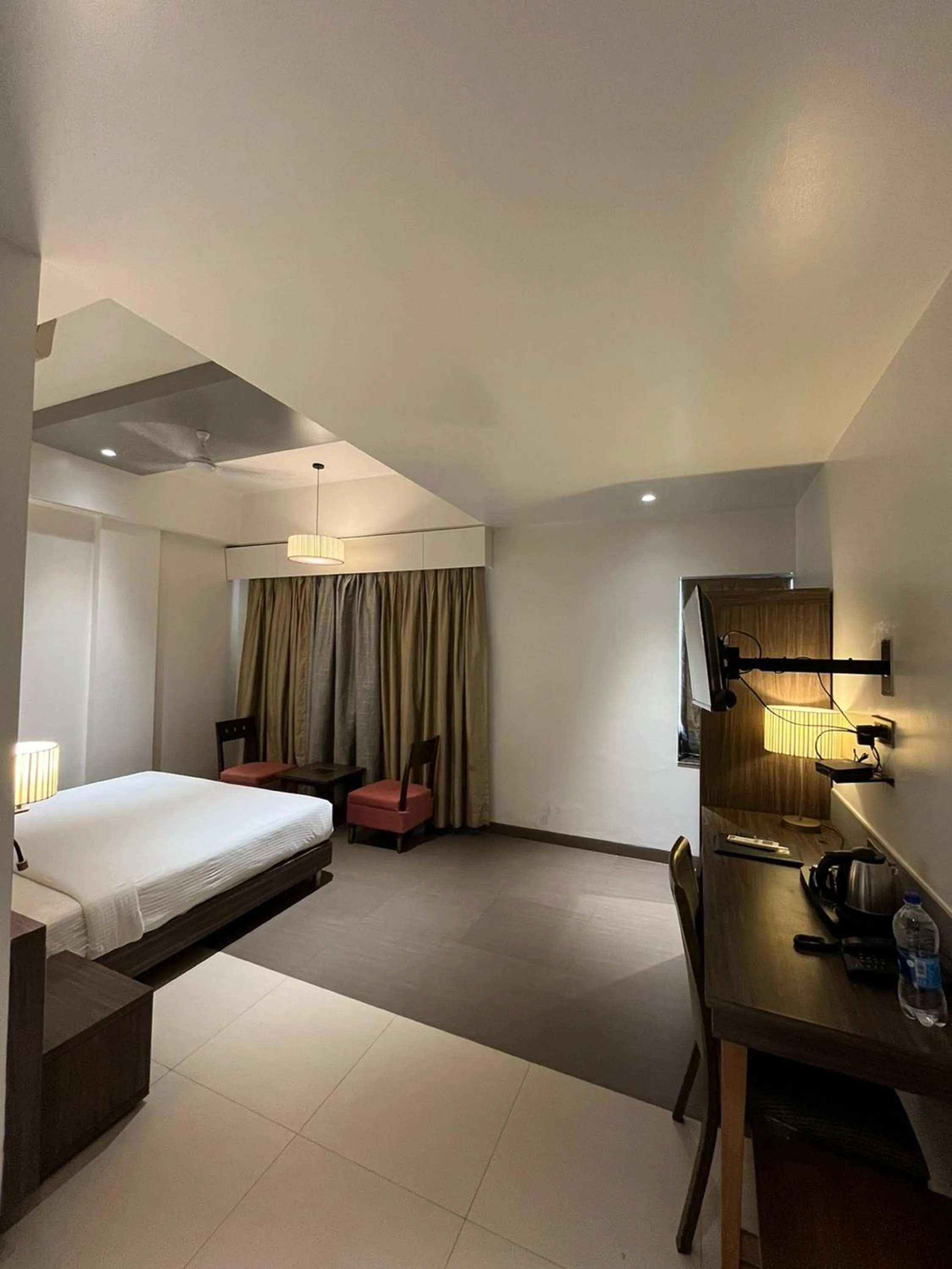 Bed in Hotel Sadanand Regency - A Regal Stay for the Modern Professional