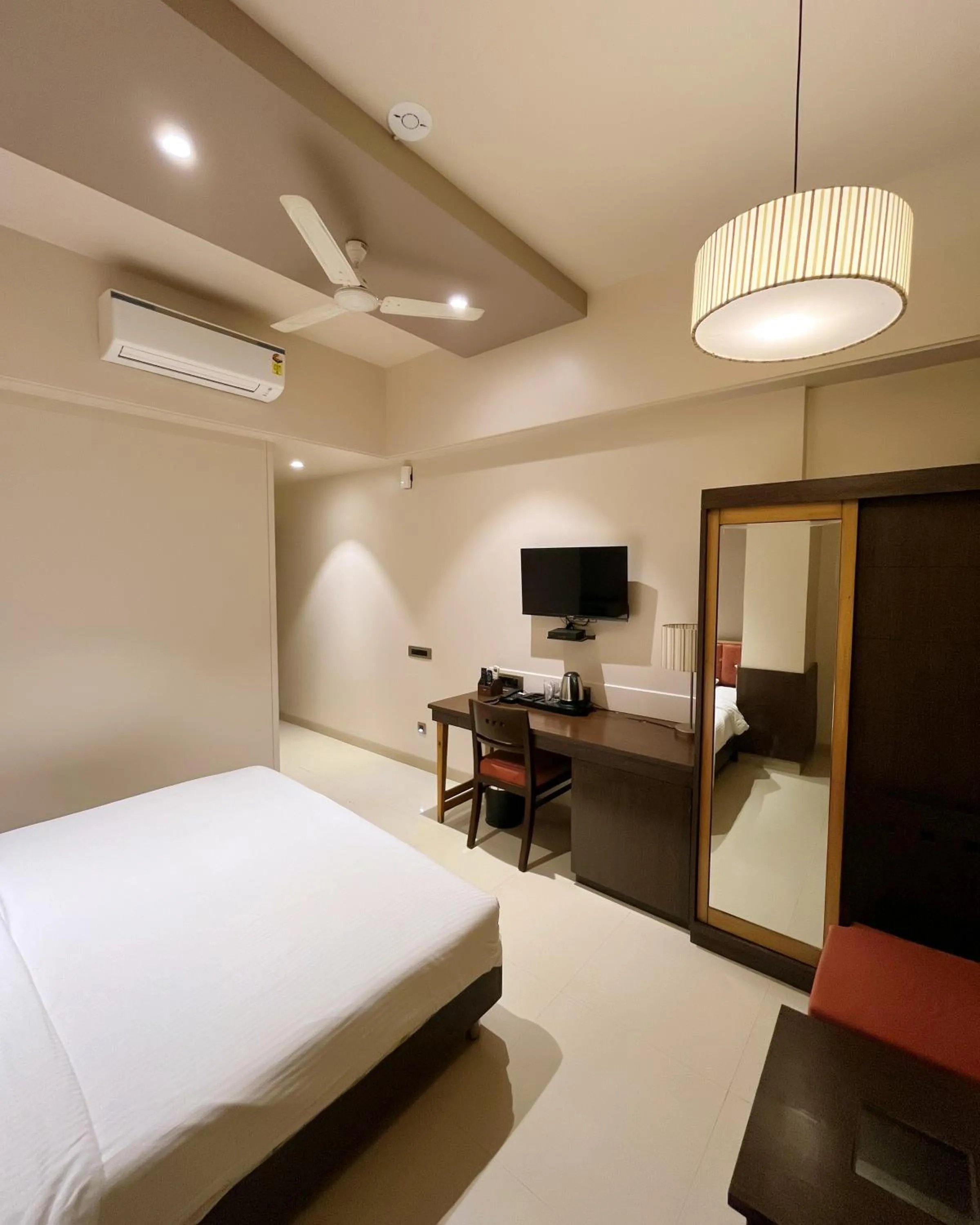 Bed in Hotel Sadanand Regency - A Regal Stay for the Modern Professional