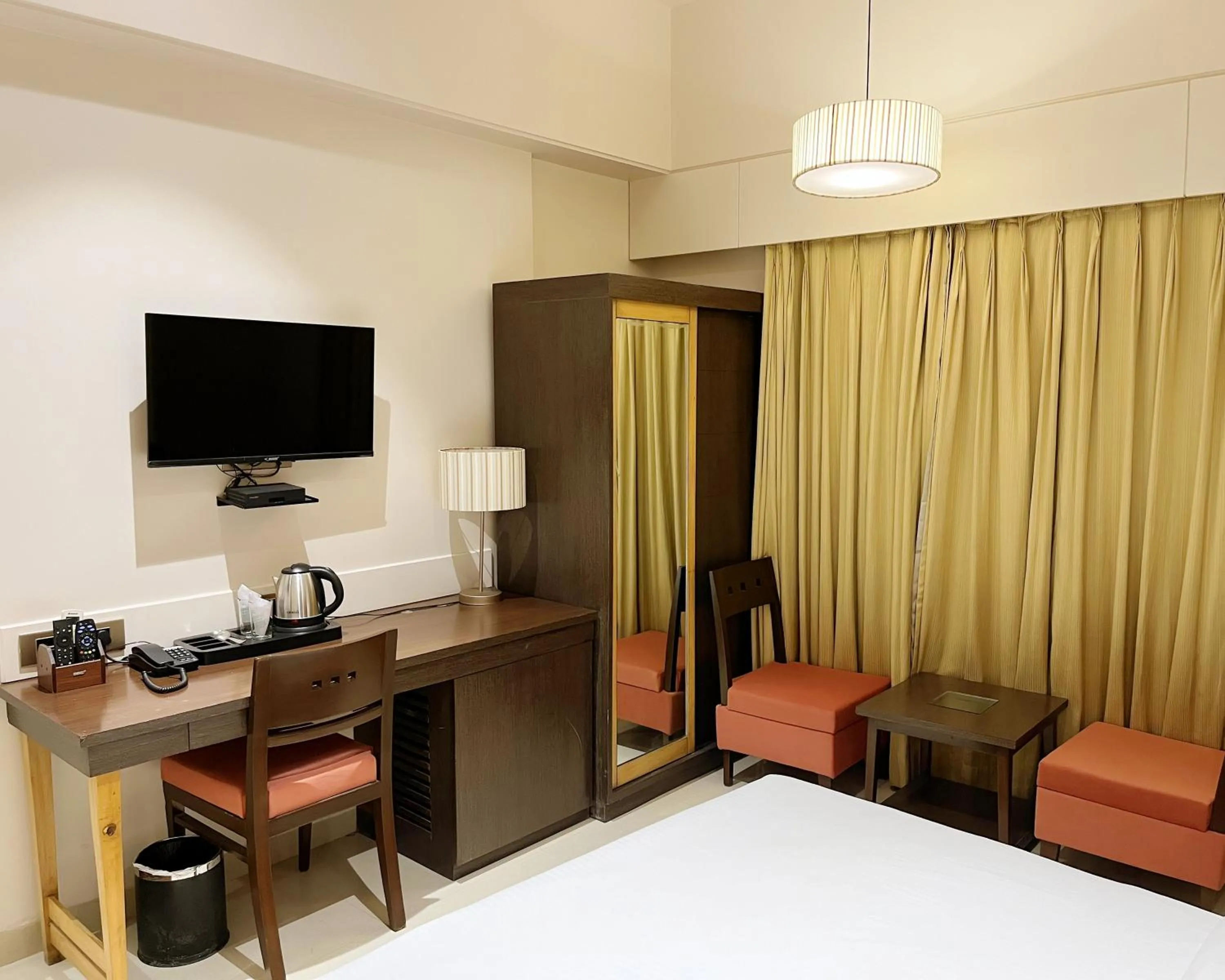 Bed in Hotel Sadanand Regency - A Regal Stay for the Modern Professional