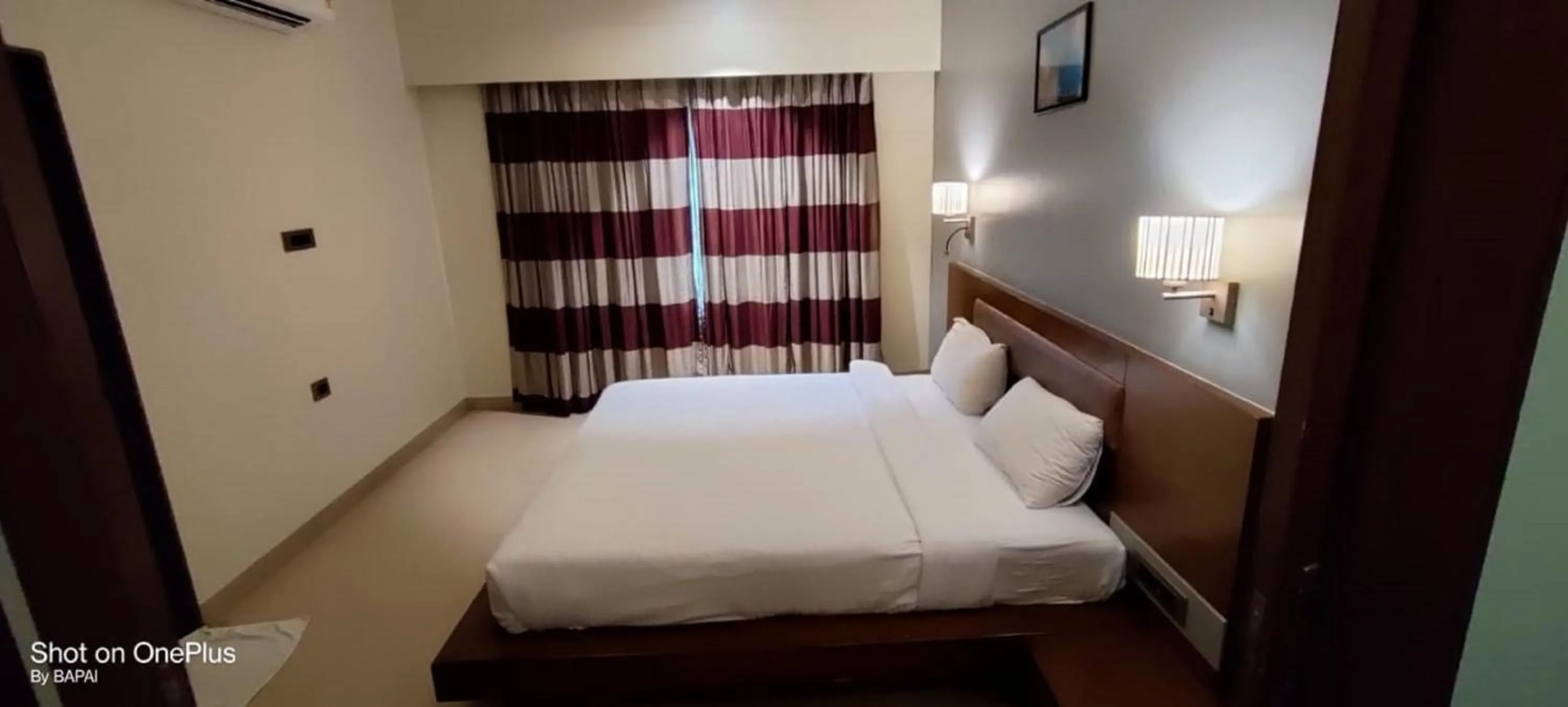 Bedroom, Bed in Hotel Sadanand Regency - A Regal Stay for the Modern Professional