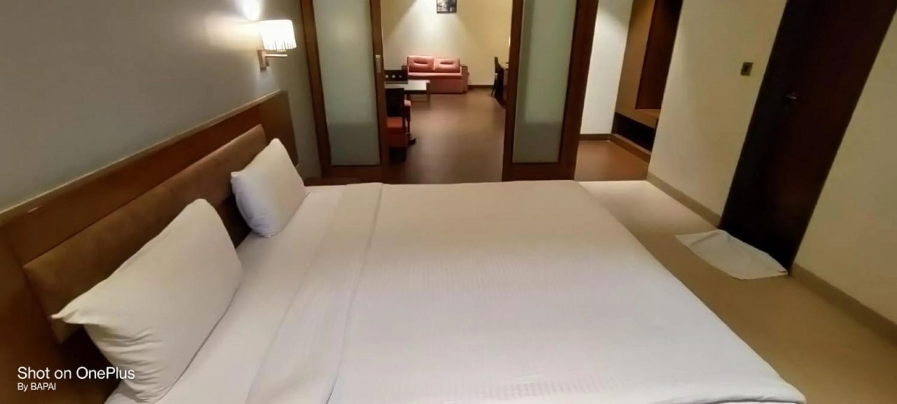 Bed in Hotel Sadanand Regency - A Regal Stay for the Modern Professional