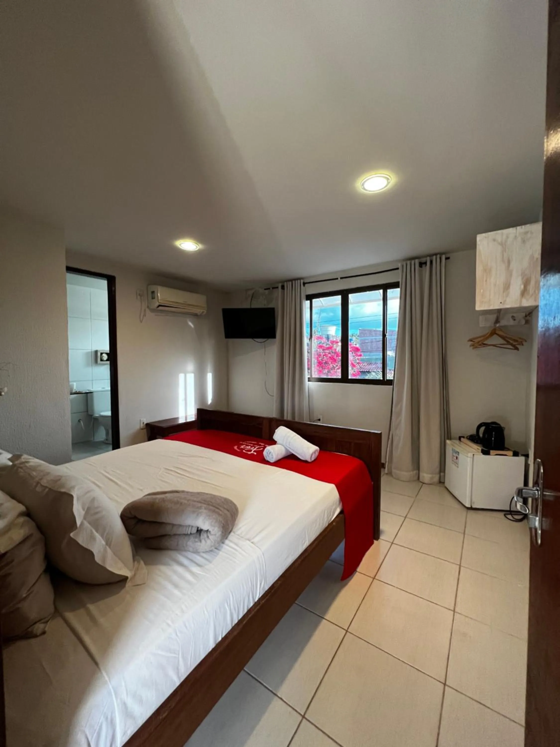 Bed in Pousada Flor de Maraca