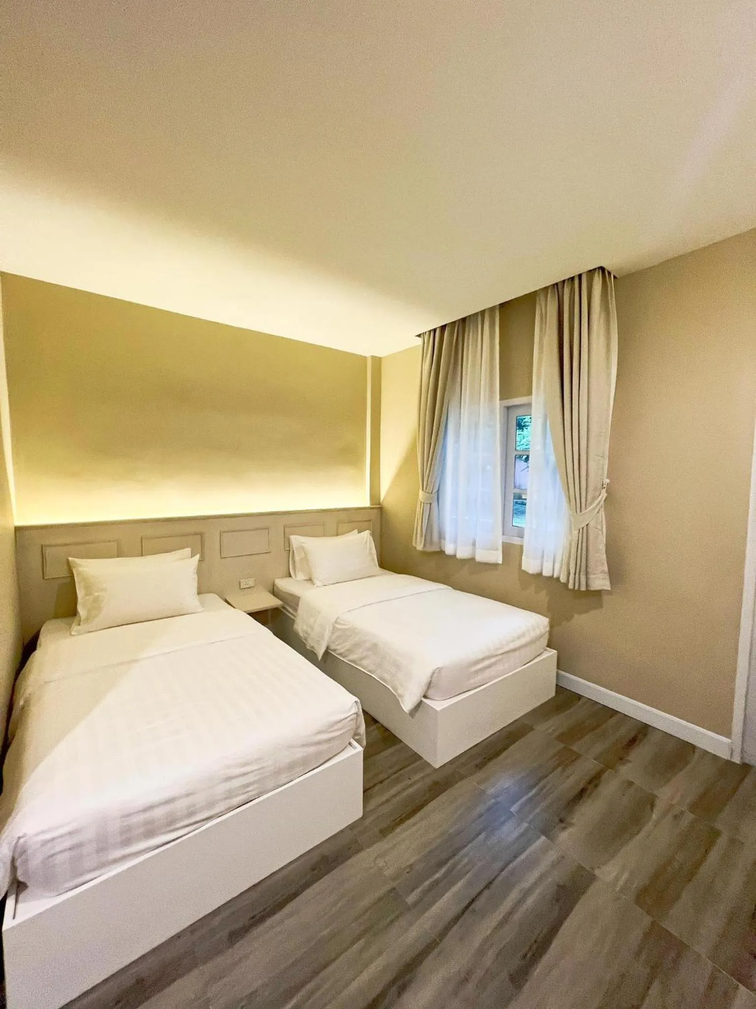 Bed in Srikij GardenHome Resort