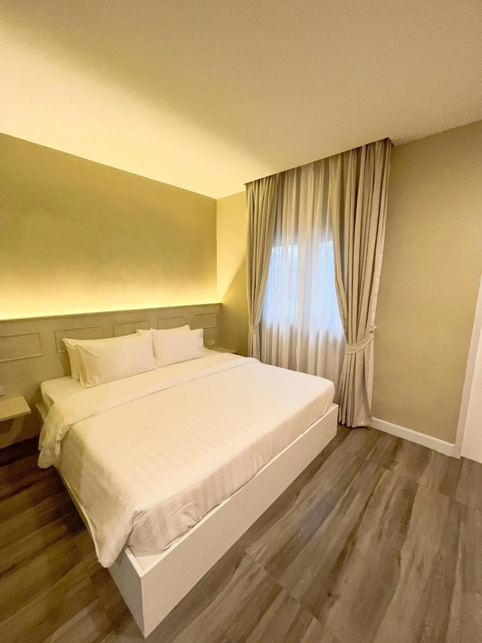 Bed in Srikij GardenHome Resort