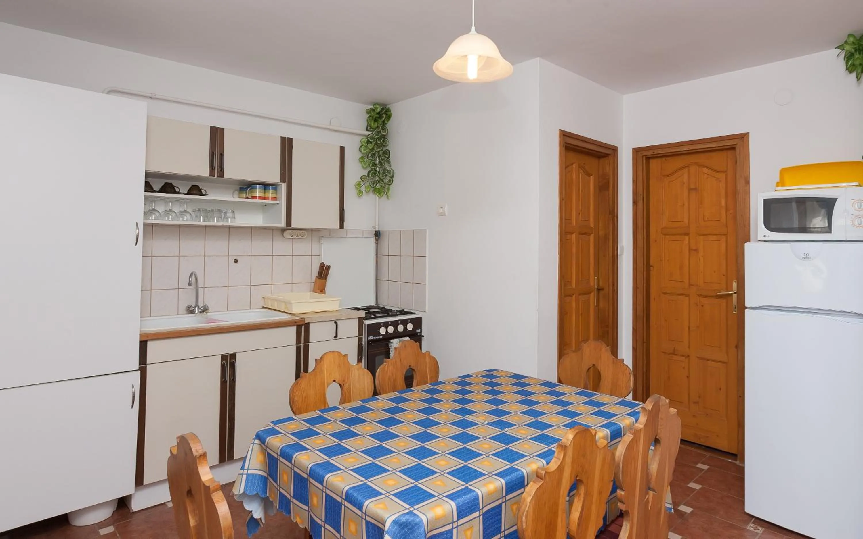 Kitchen or kitchenette in Páratlan Apartmanház