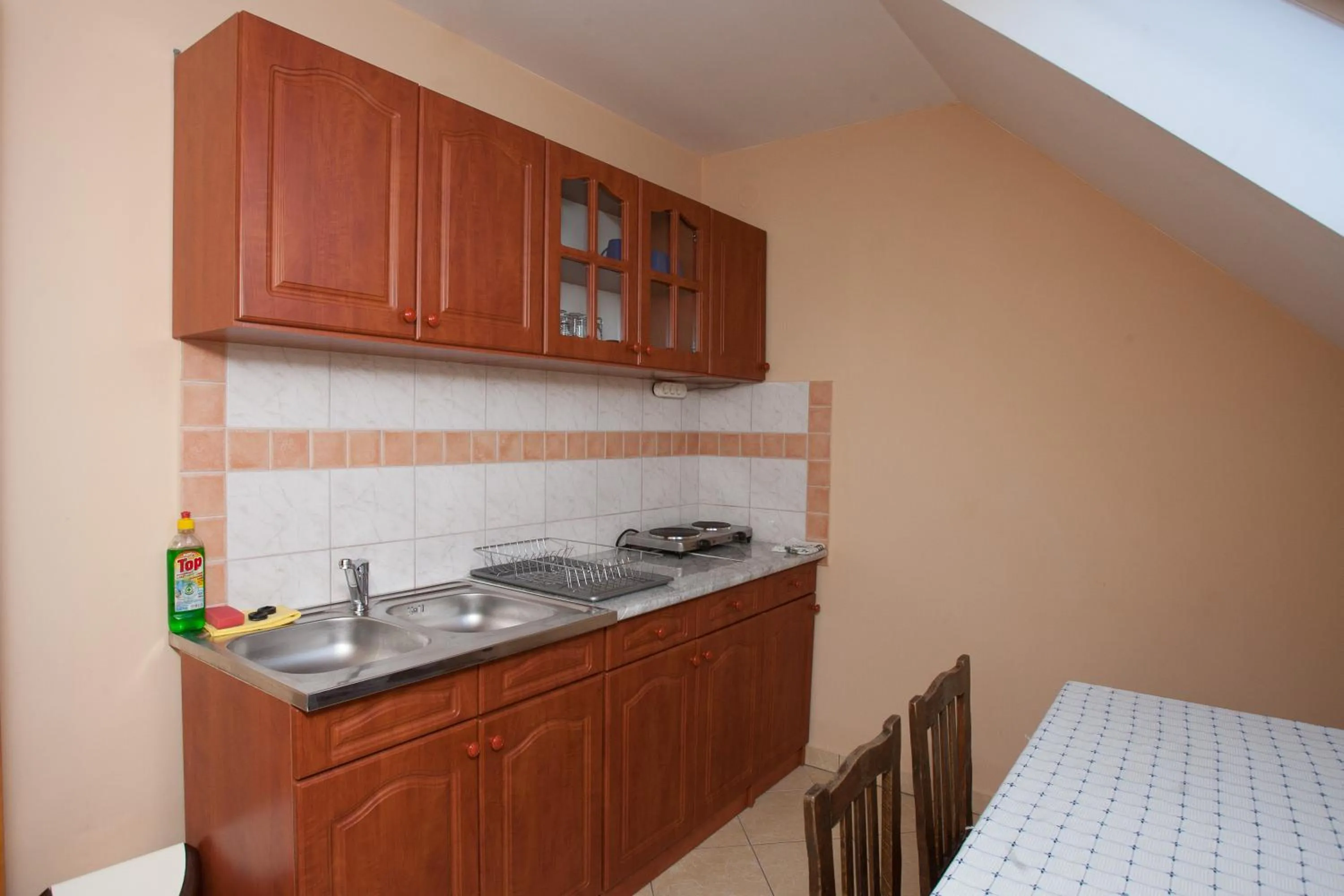 Kitchen or kitchenette in Páratlan Apartmanház