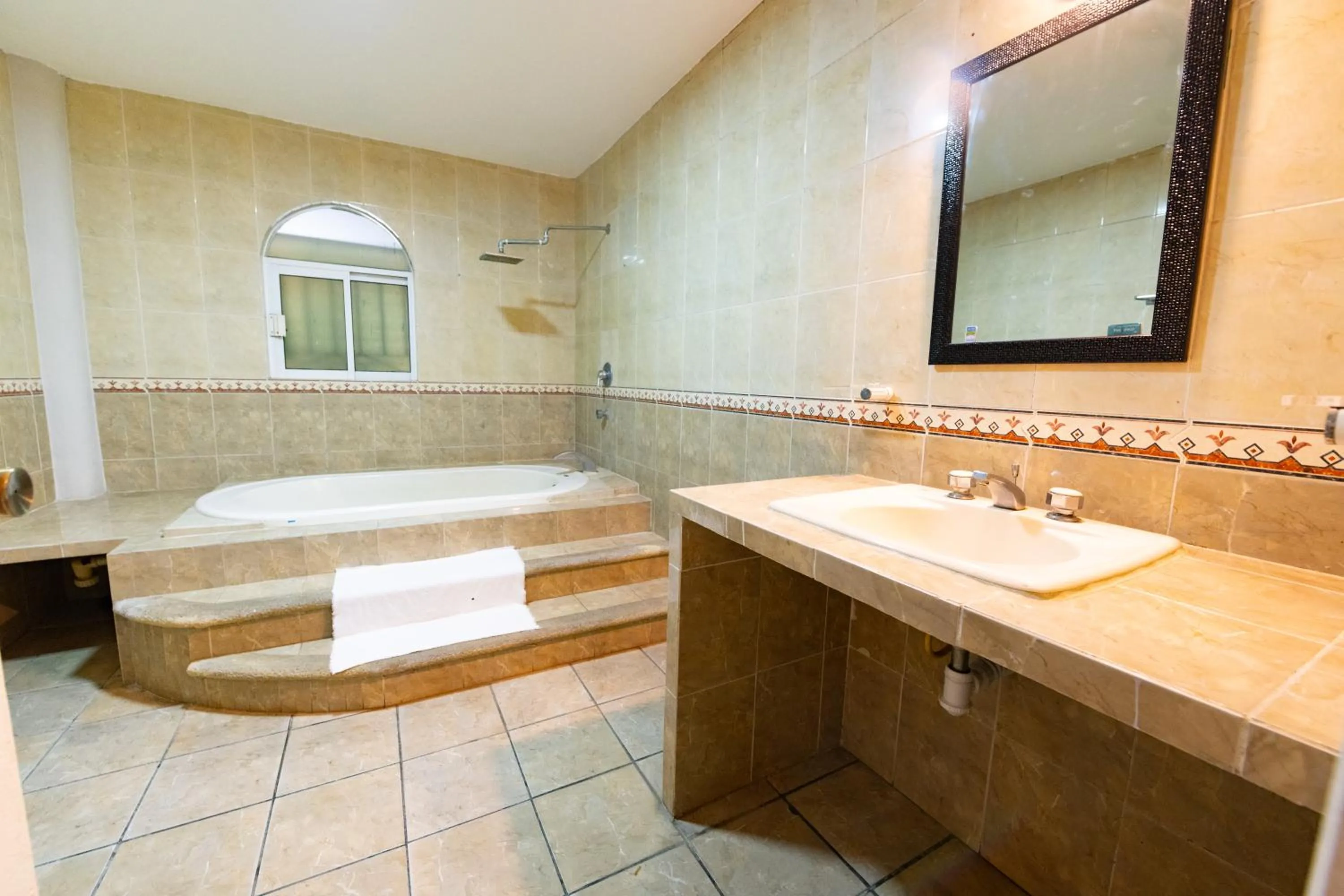 Bathroom in Boca Inn Hotel & Suites