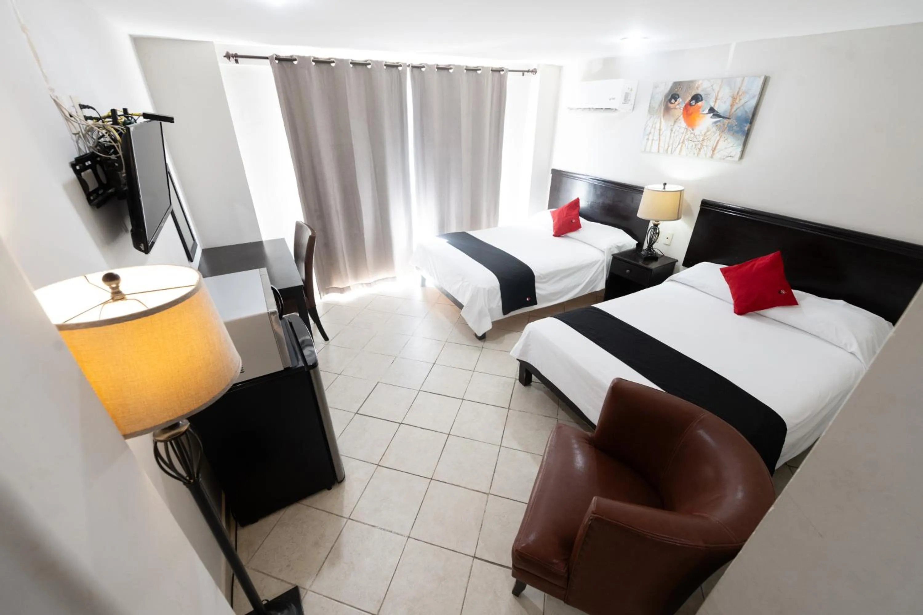 Bed in Boca Inn Hotel & Suites