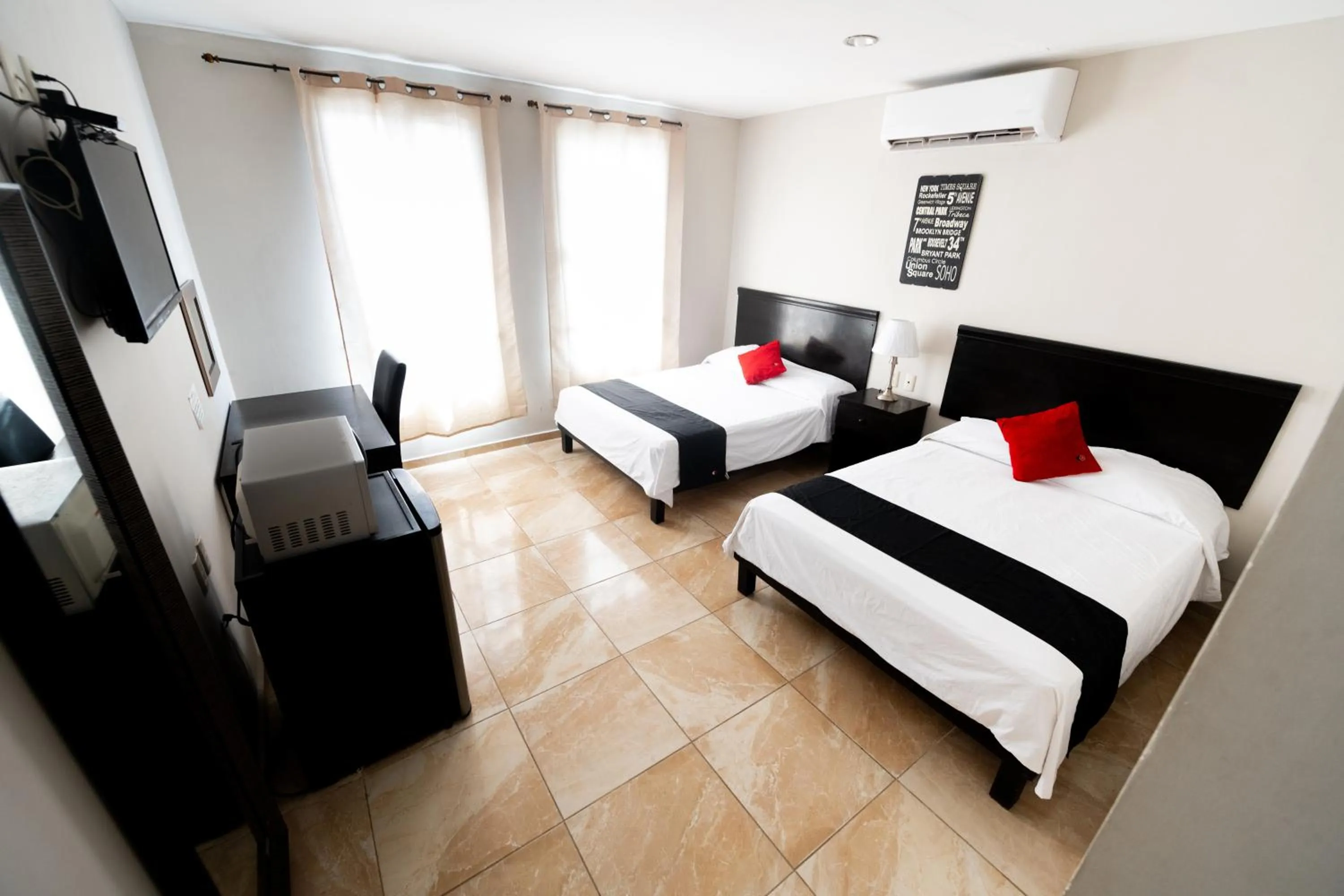 Photo of the whole room, Bed in Boca Inn Hotel & Suites