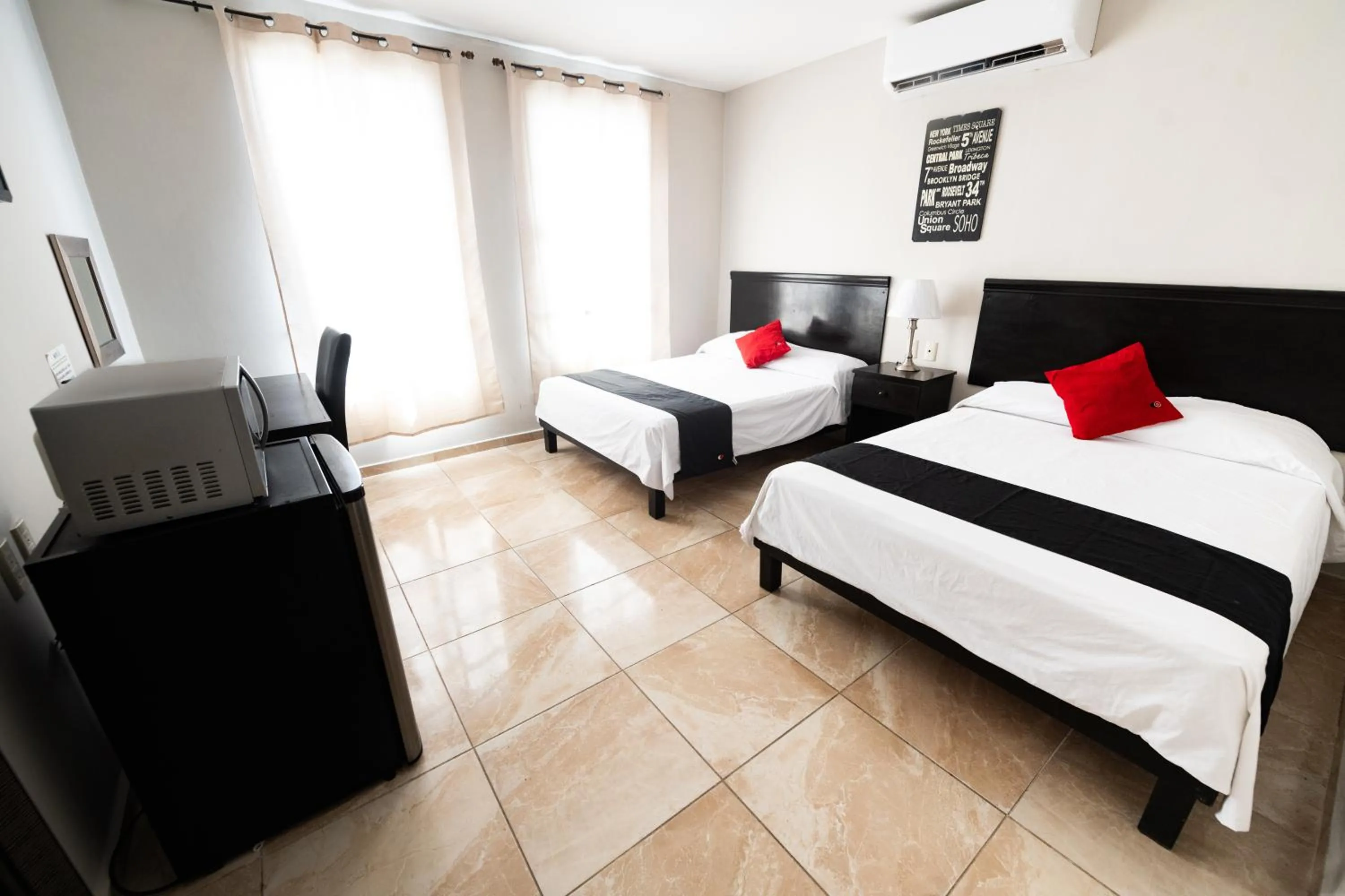 Photo of the whole room, Bed in Boca Inn Hotel & Suites