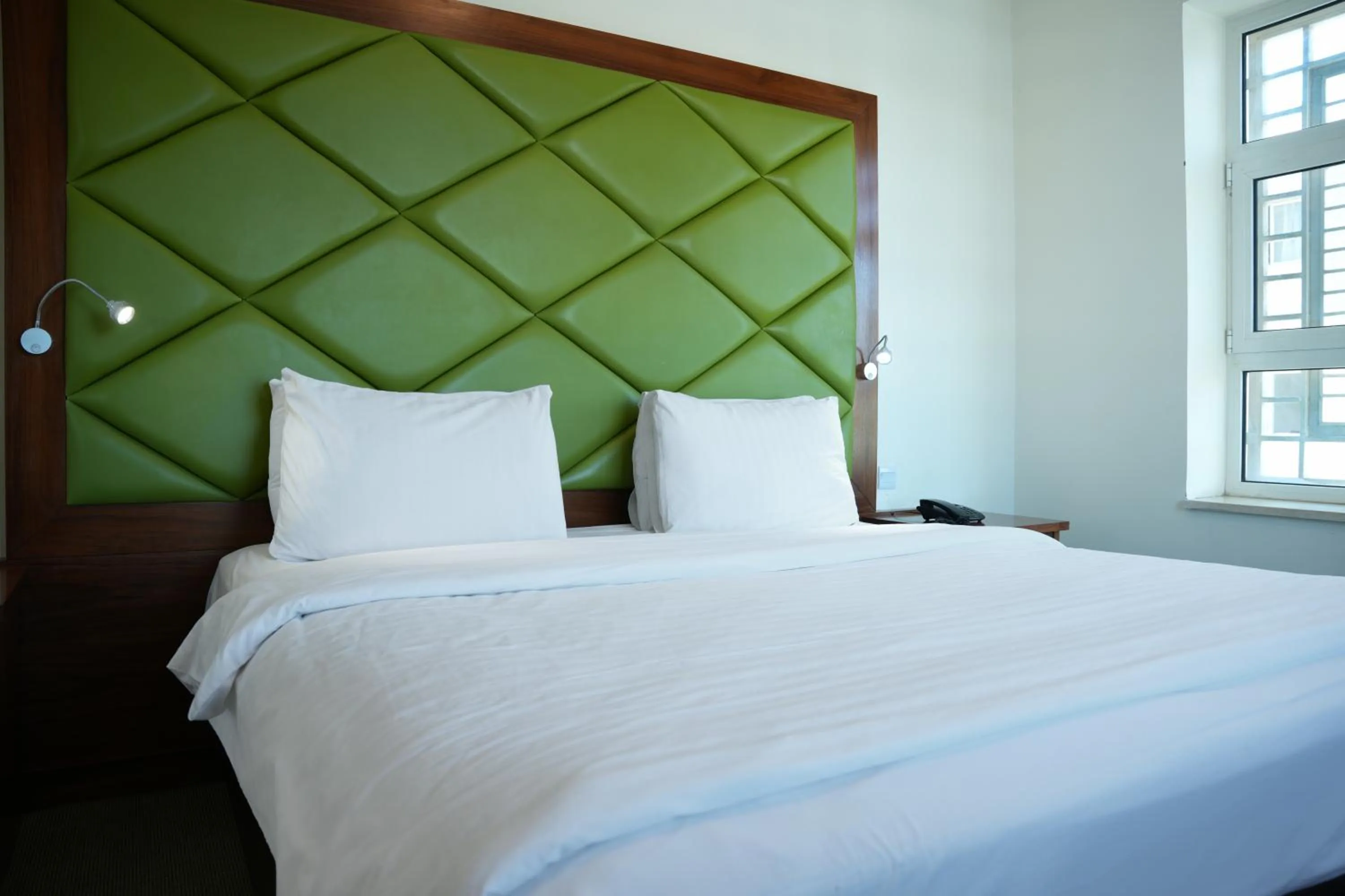 Bed in Holyland Hotel Amman