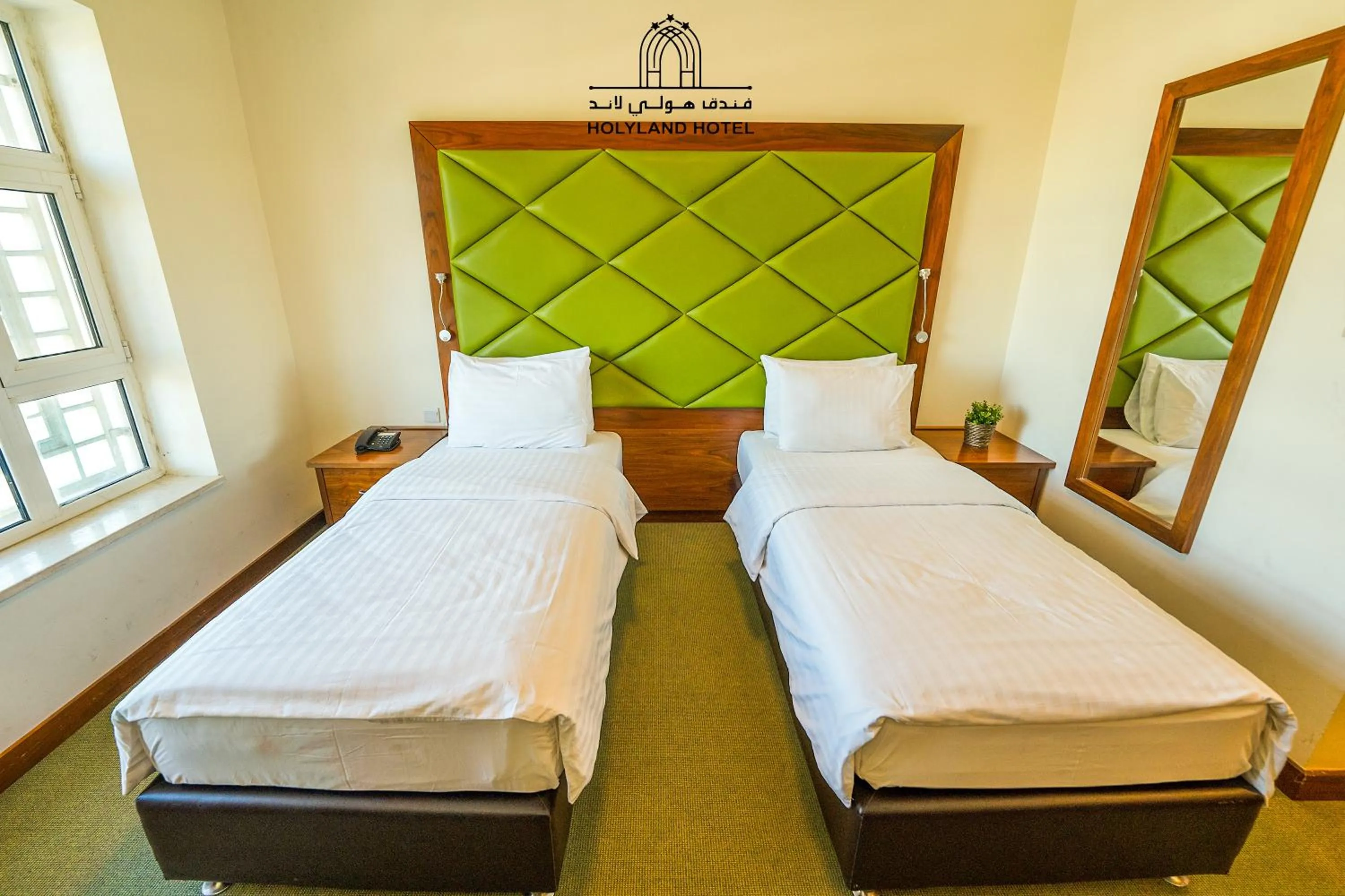 Bed in Holyland Hotel Amman