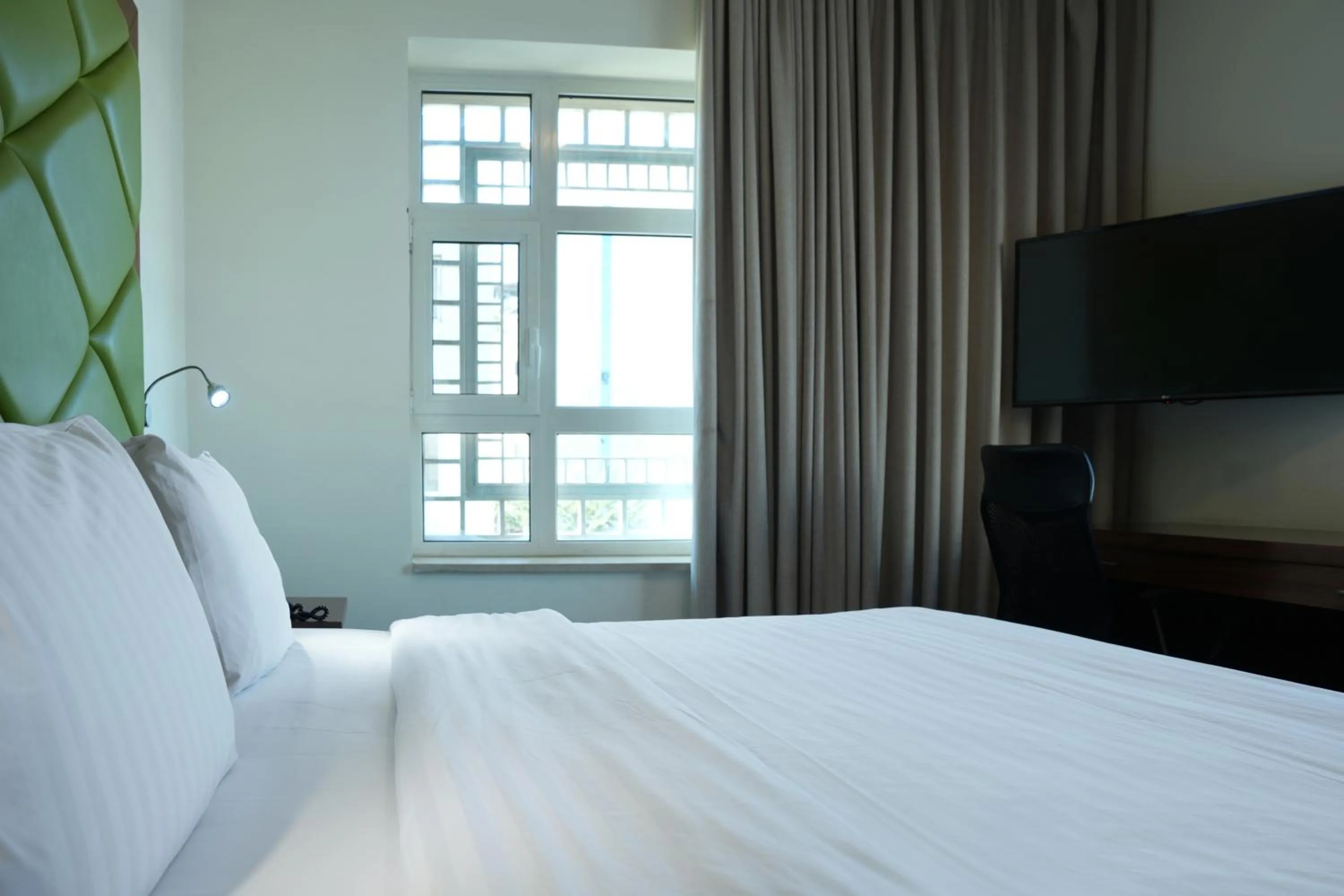 TV and multimedia, Bed in Holyland Hotel Amman