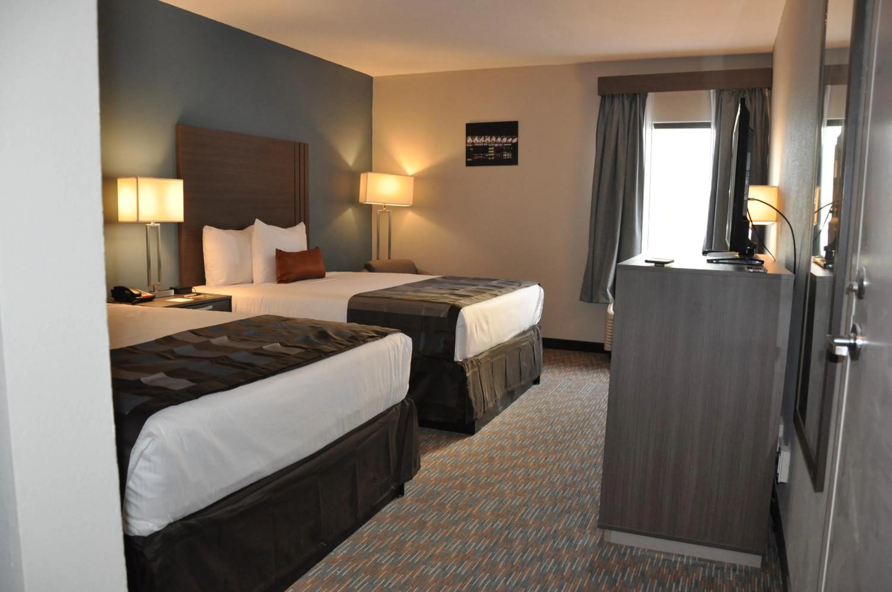 Bedroom, Bed in Nobile Hotel Parkway at Celebration Orlando Very Close to Disney Theme Parks