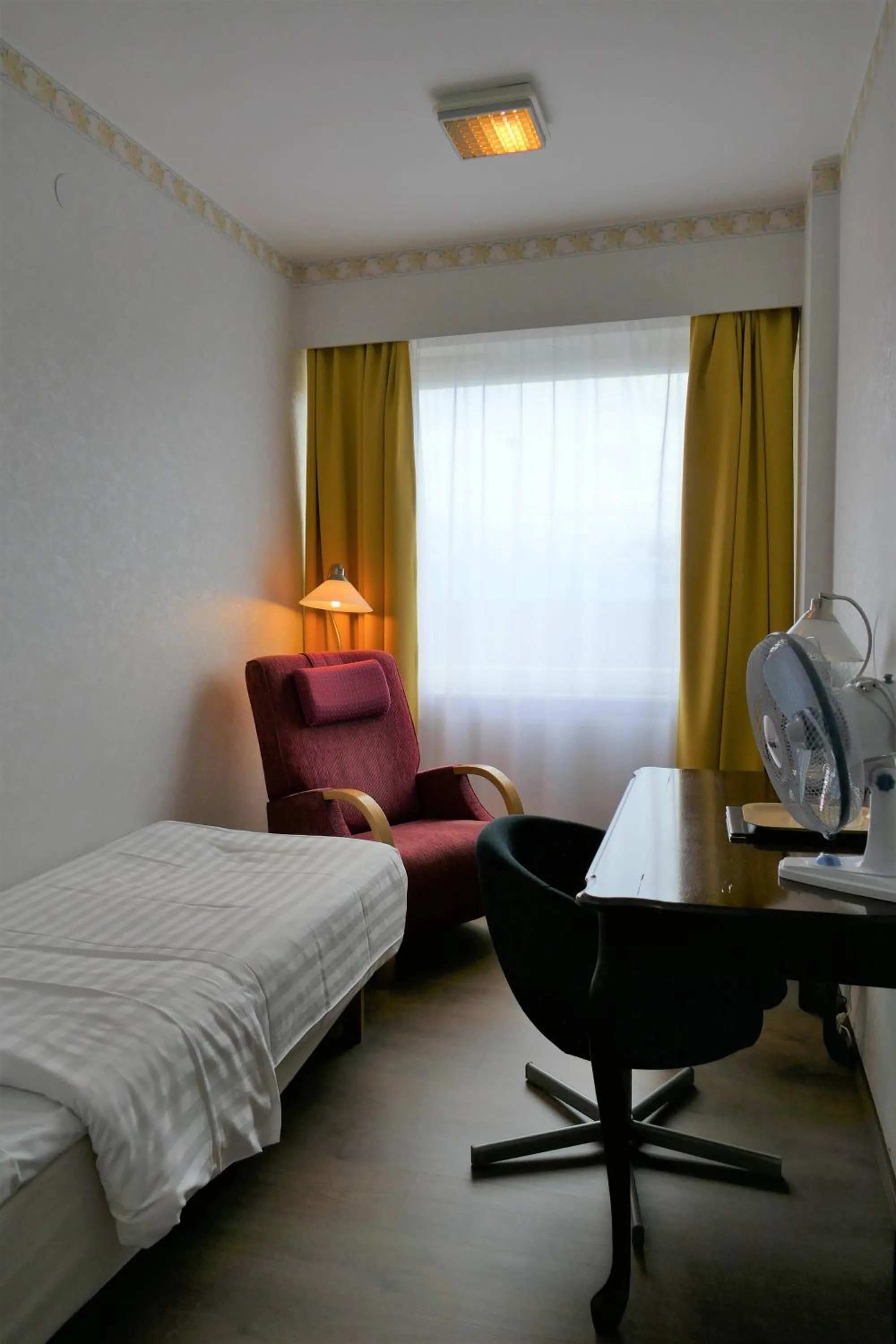 Bed in Linnanpiha Bed & Breakfast