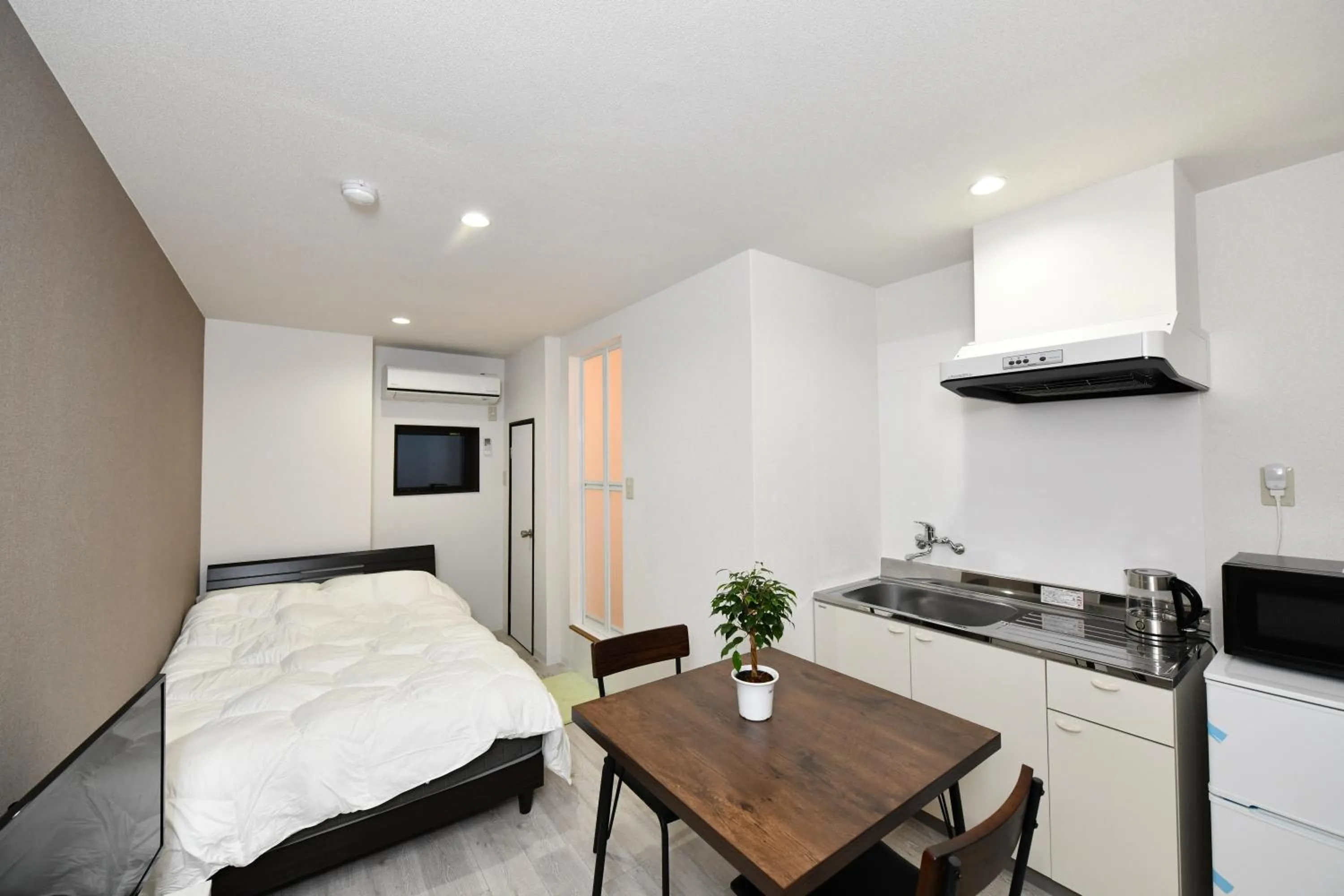 Bed in Suzumaru Hotel