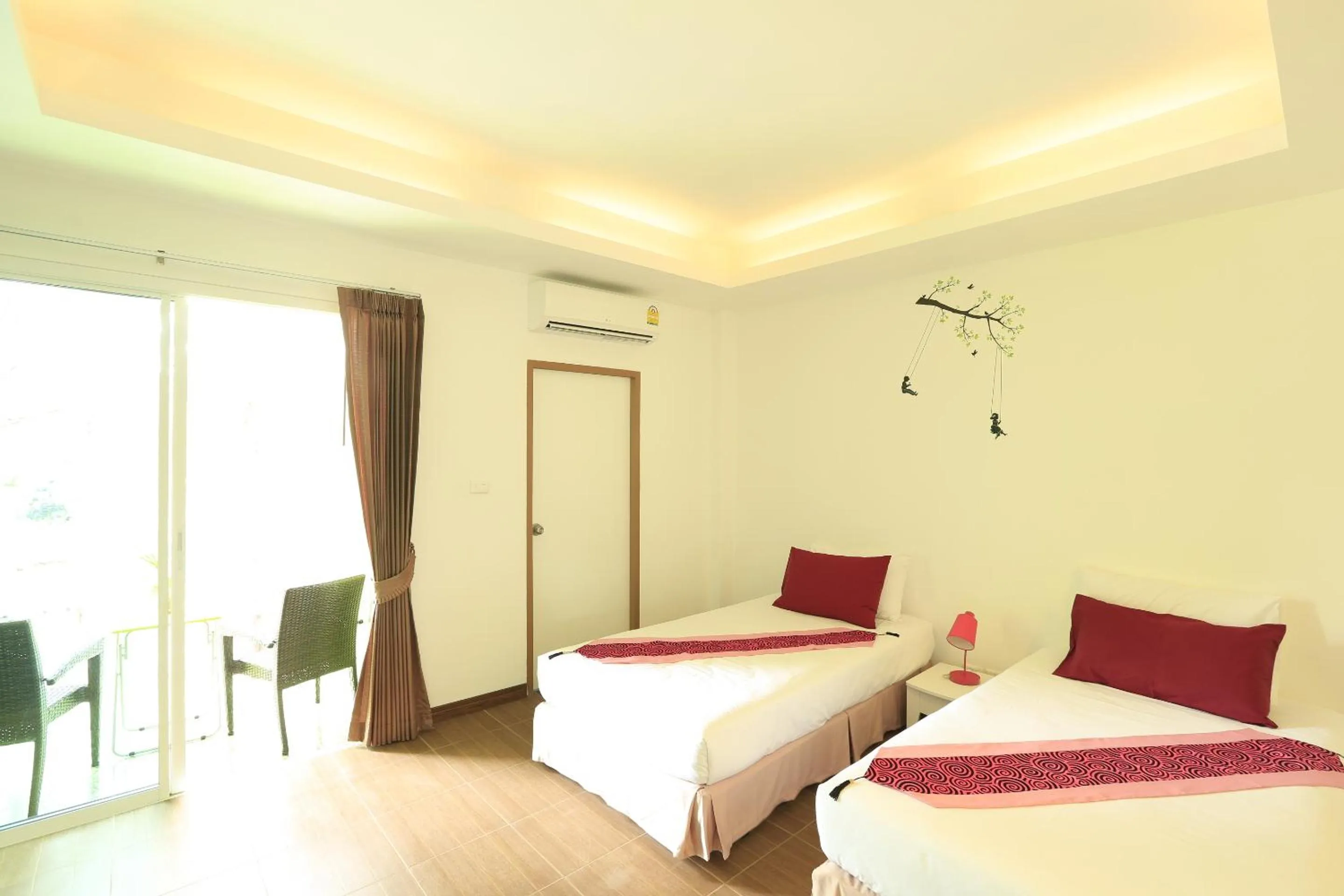 Bed in White Cat Hotel