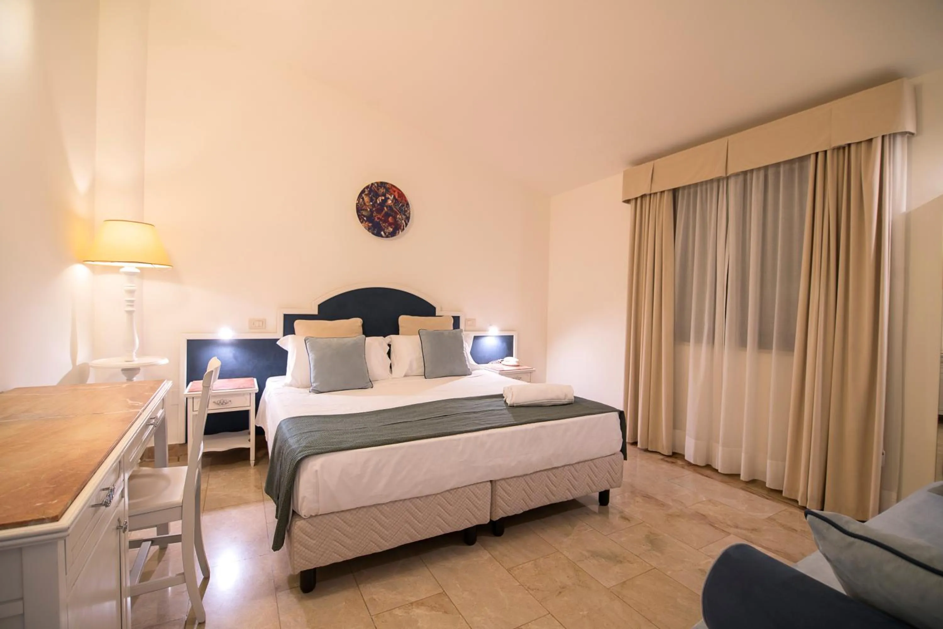 Bed in Delfino Beach Hotel