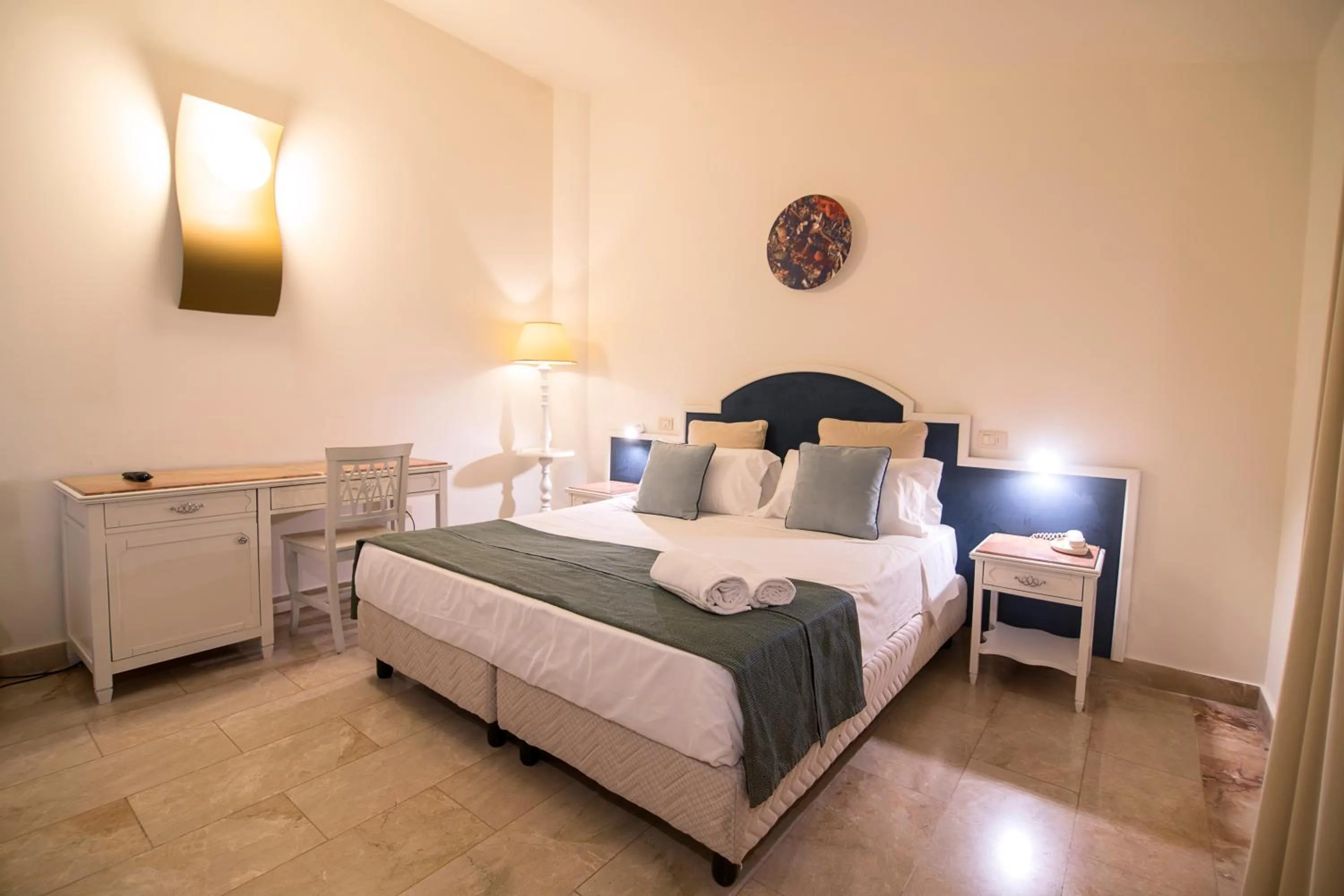 Bed in Delfino Beach Hotel