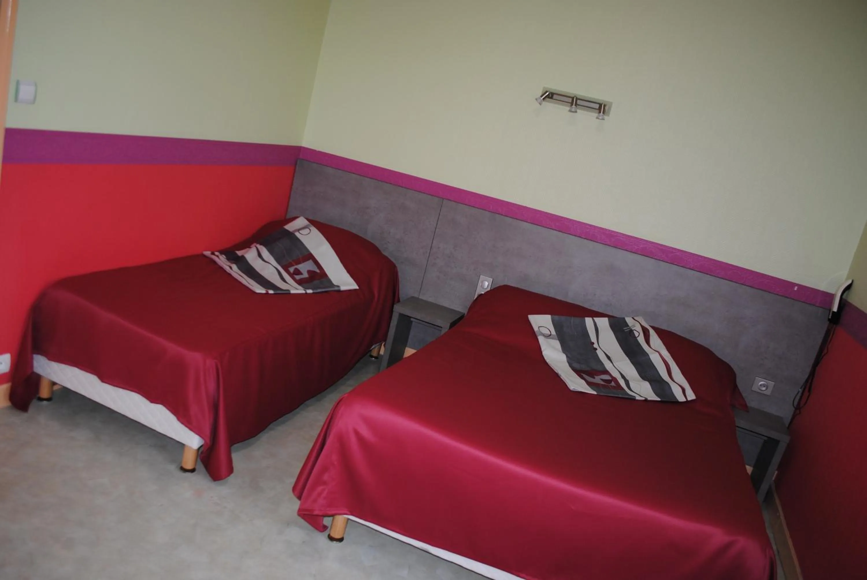 Bed in Hotel des voyageurs Chez Betty