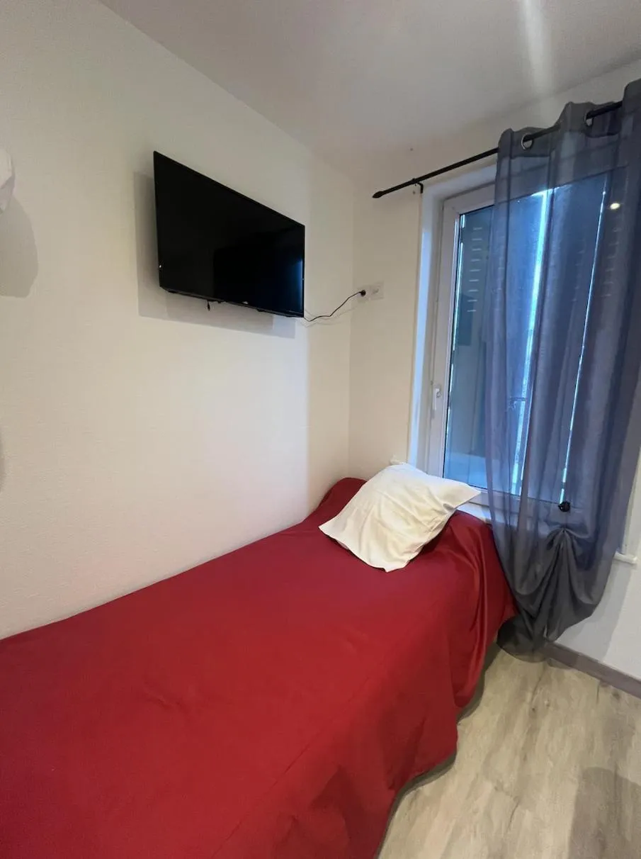 Bed in Hotel des voyageurs Chez Betty