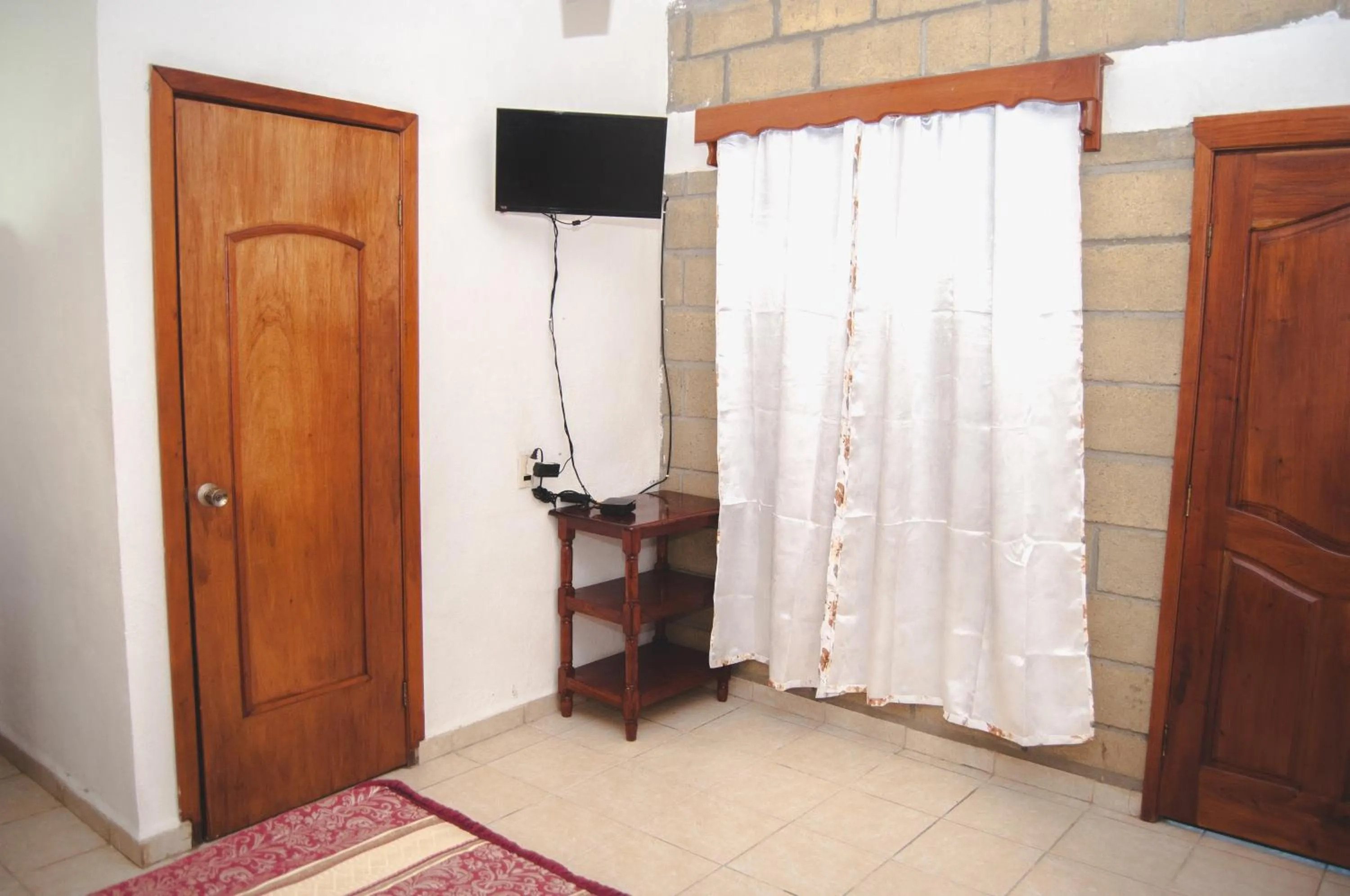 TV and multimedia in Hotel y Restaurante EL TEXANO