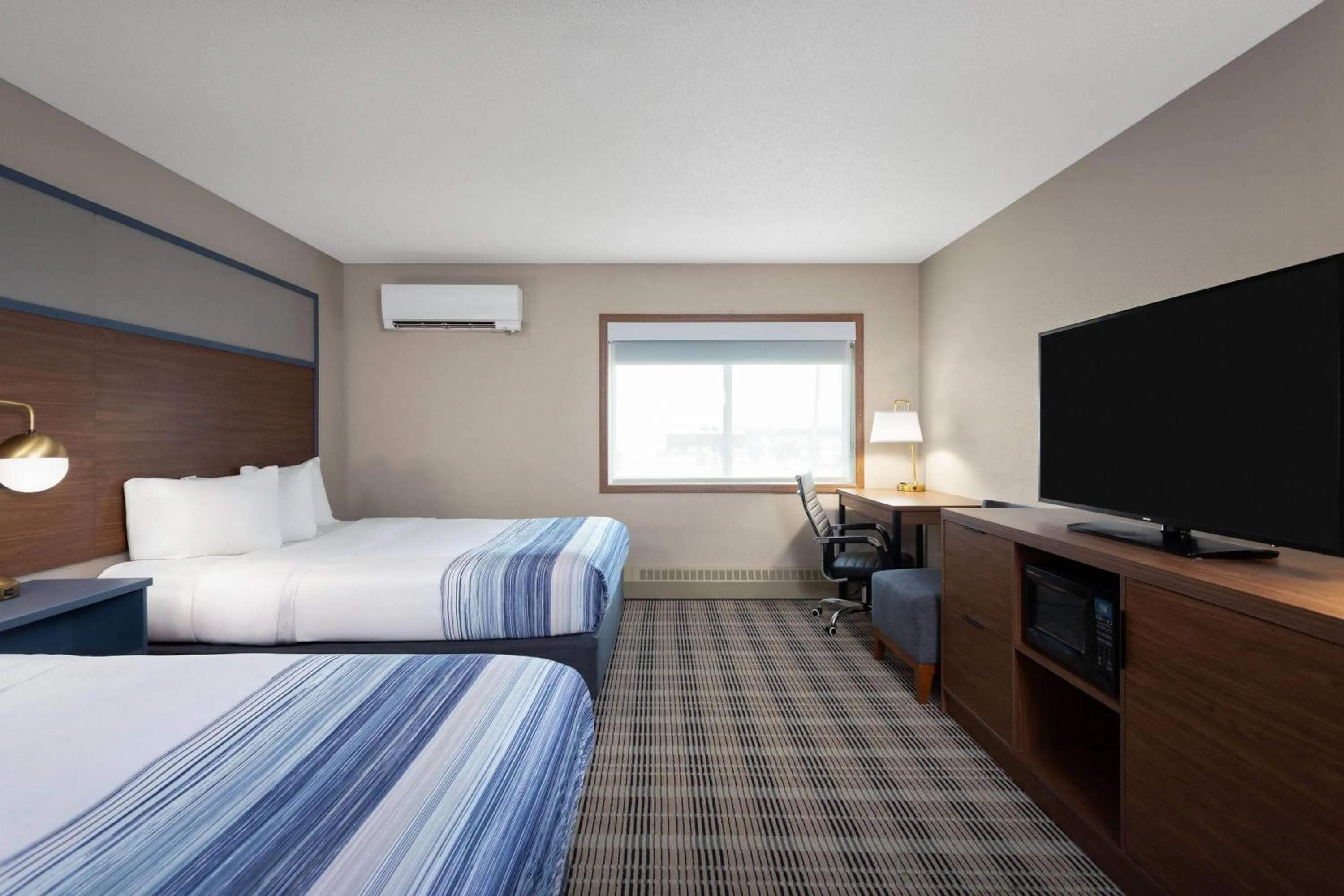 Photo of the whole room, Bed in AmericInn by Wyndham Roseau