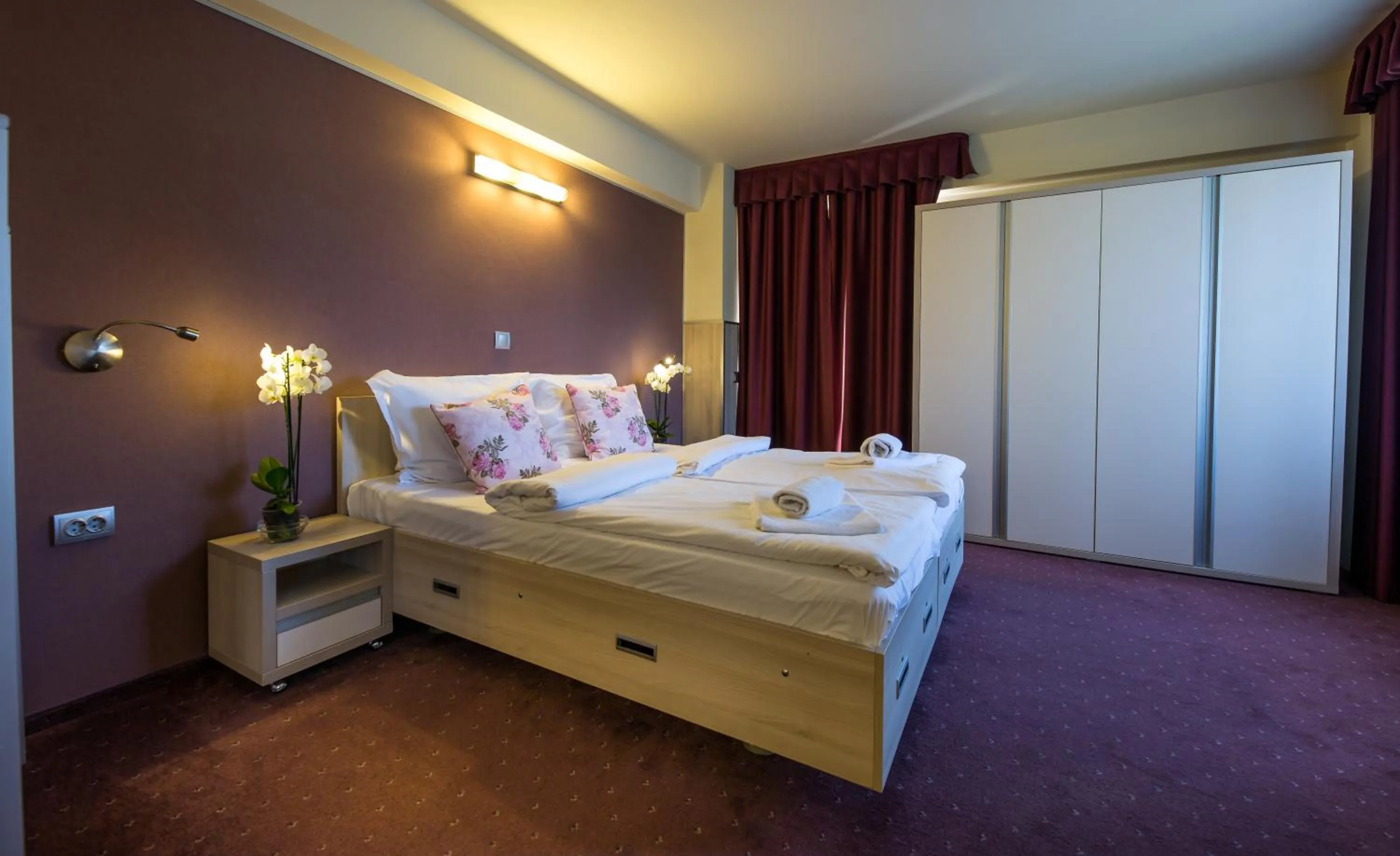 Bed in Eden Grand Resort