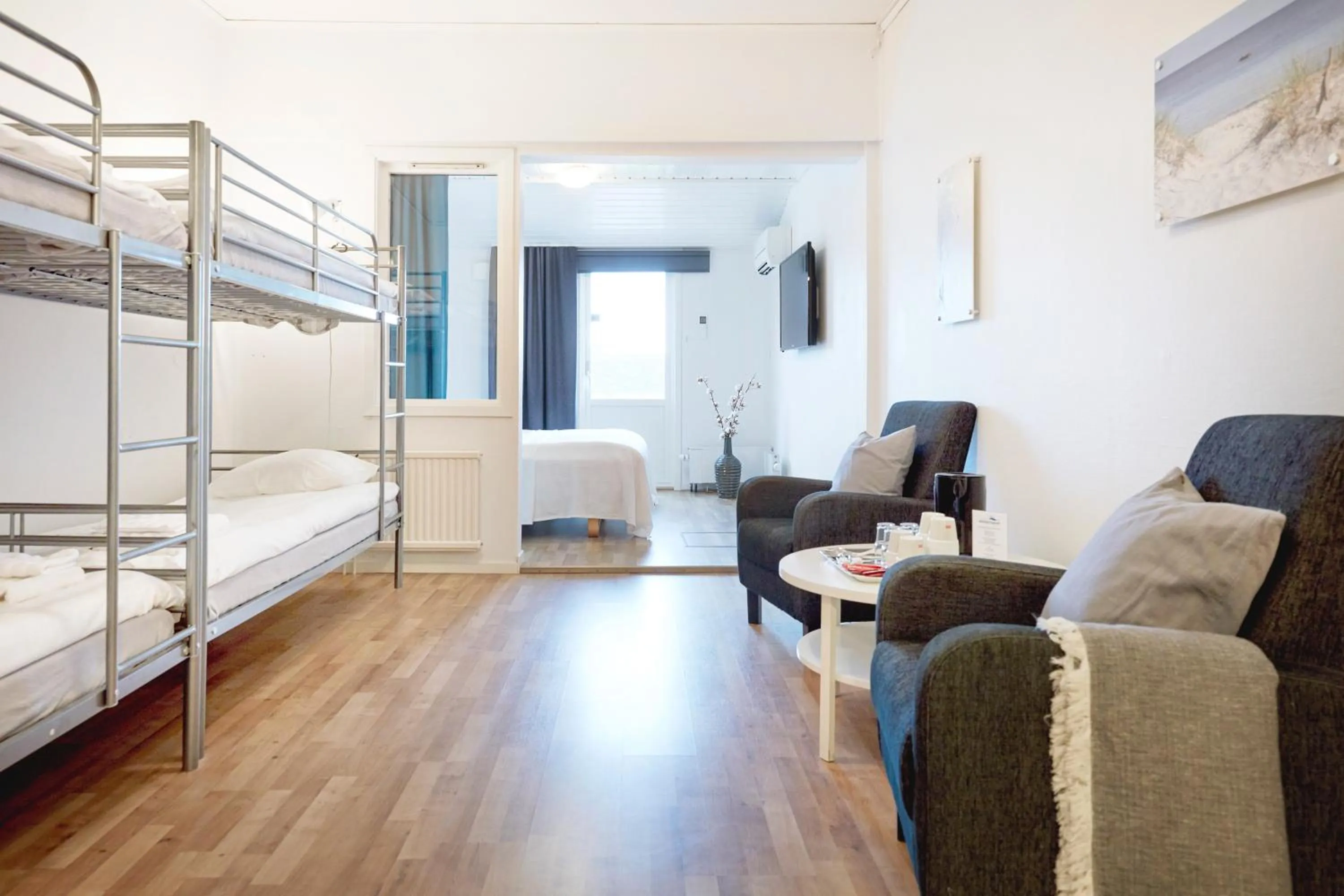 Seating area, Bed in Hotell Vesterhavet