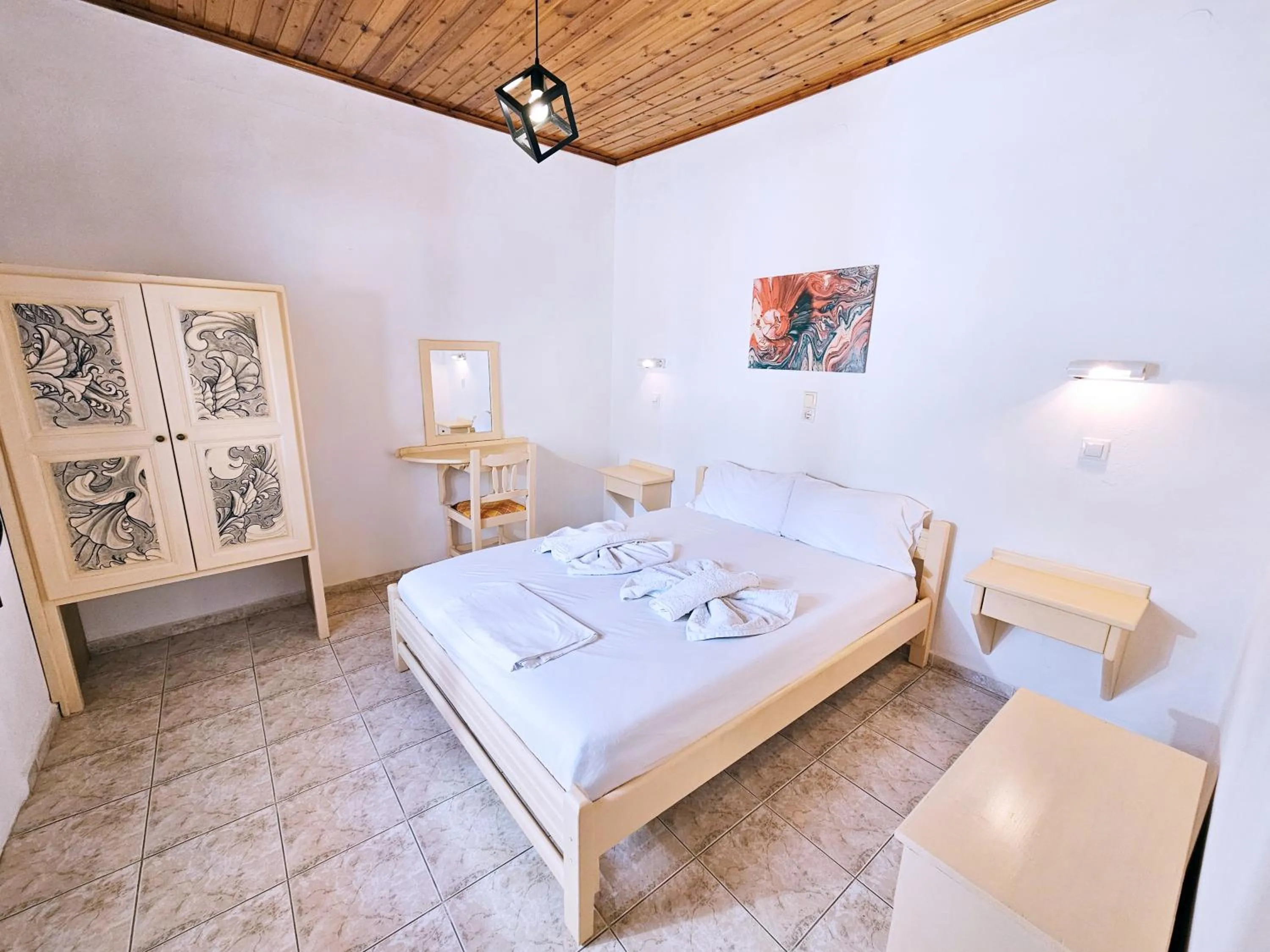 Bed in Pavlis Studios Kampos