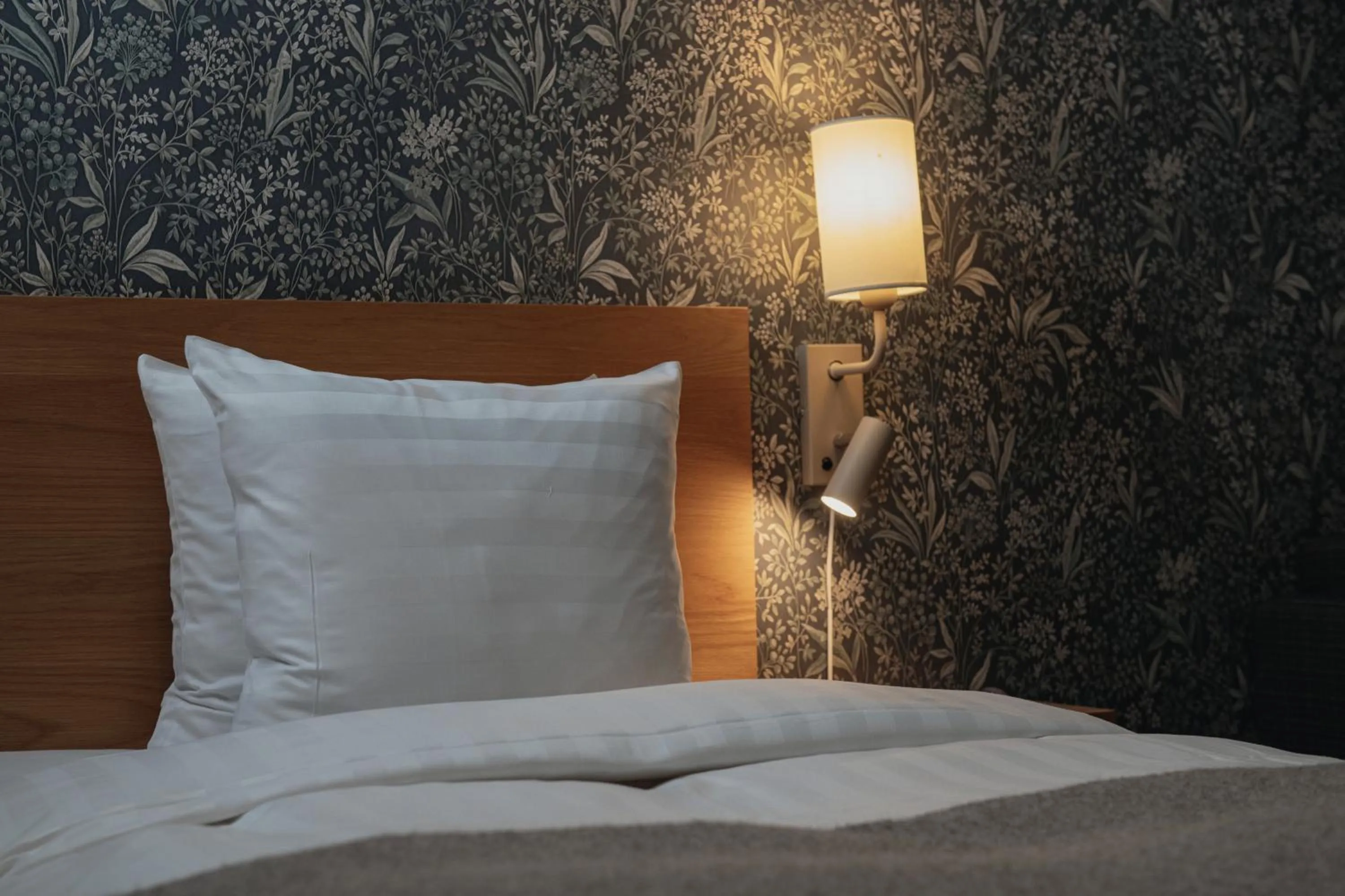 Bed in Home Hotel Mektagonen