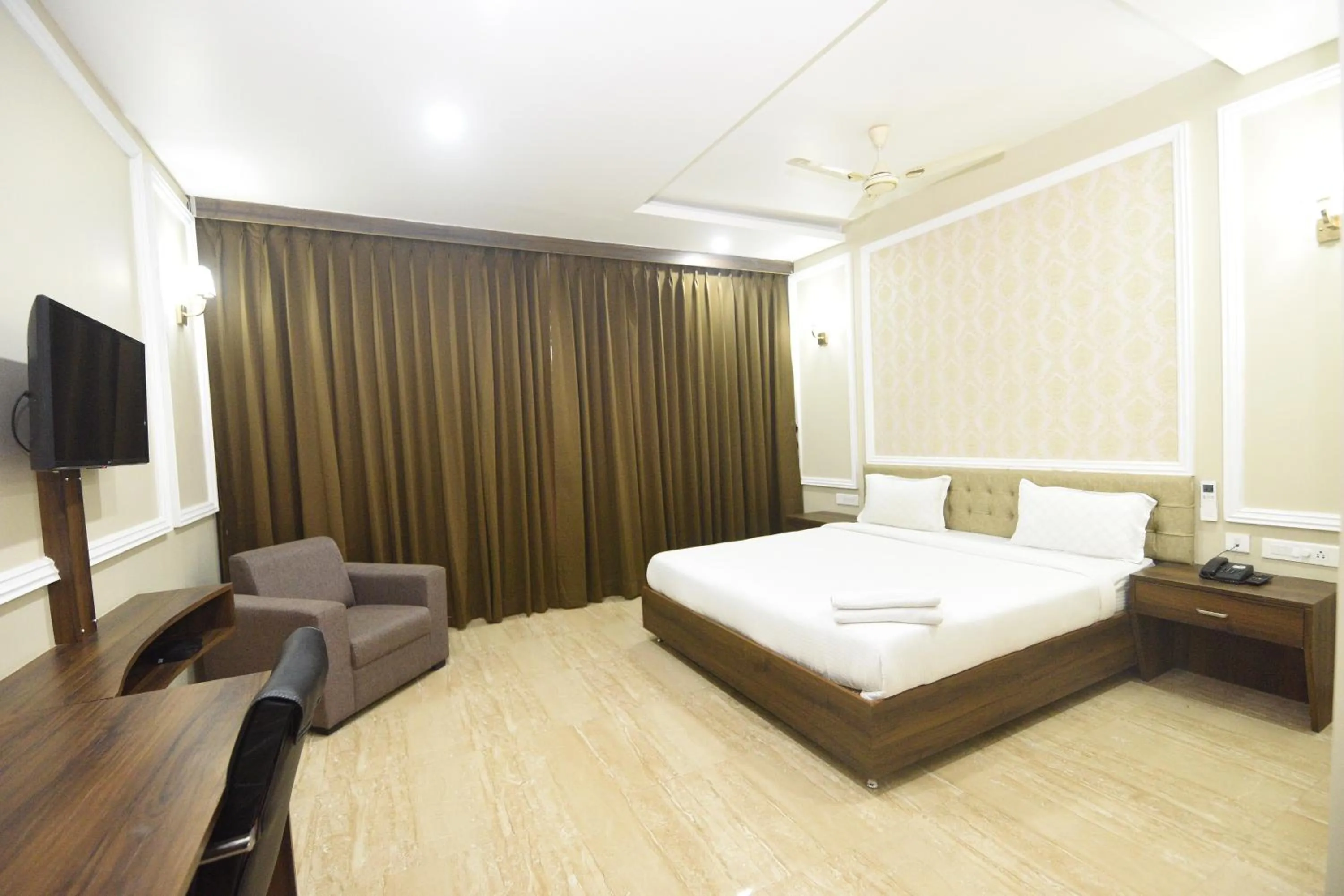 Photo of the whole room, Bed in Hotel Nilay Residency